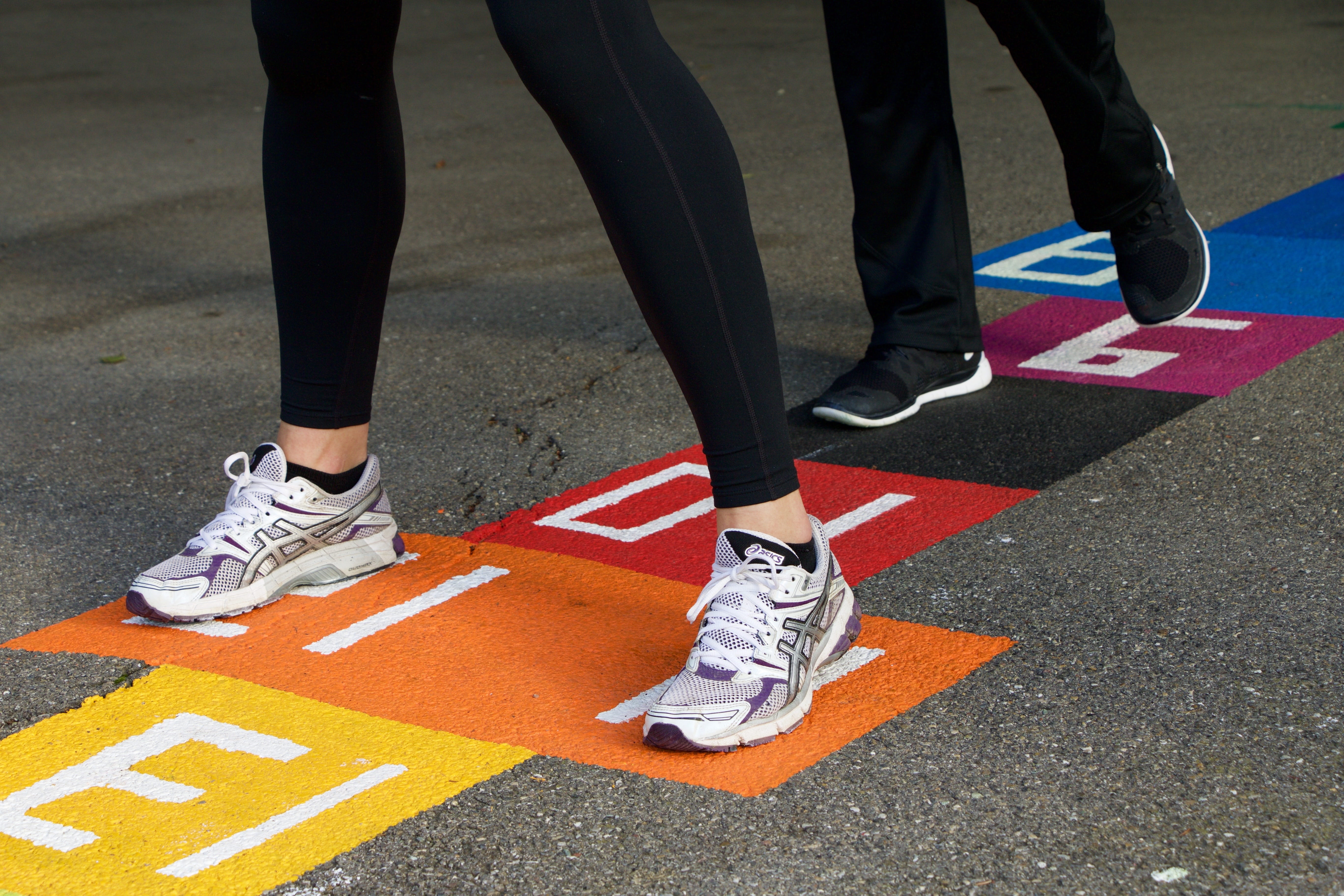human limb, shoes, person, asics, city, road, standing, symbol, sign, transportation, pay, purple, real people, lifestyles, children, day, running, hop, HD Wallpaper