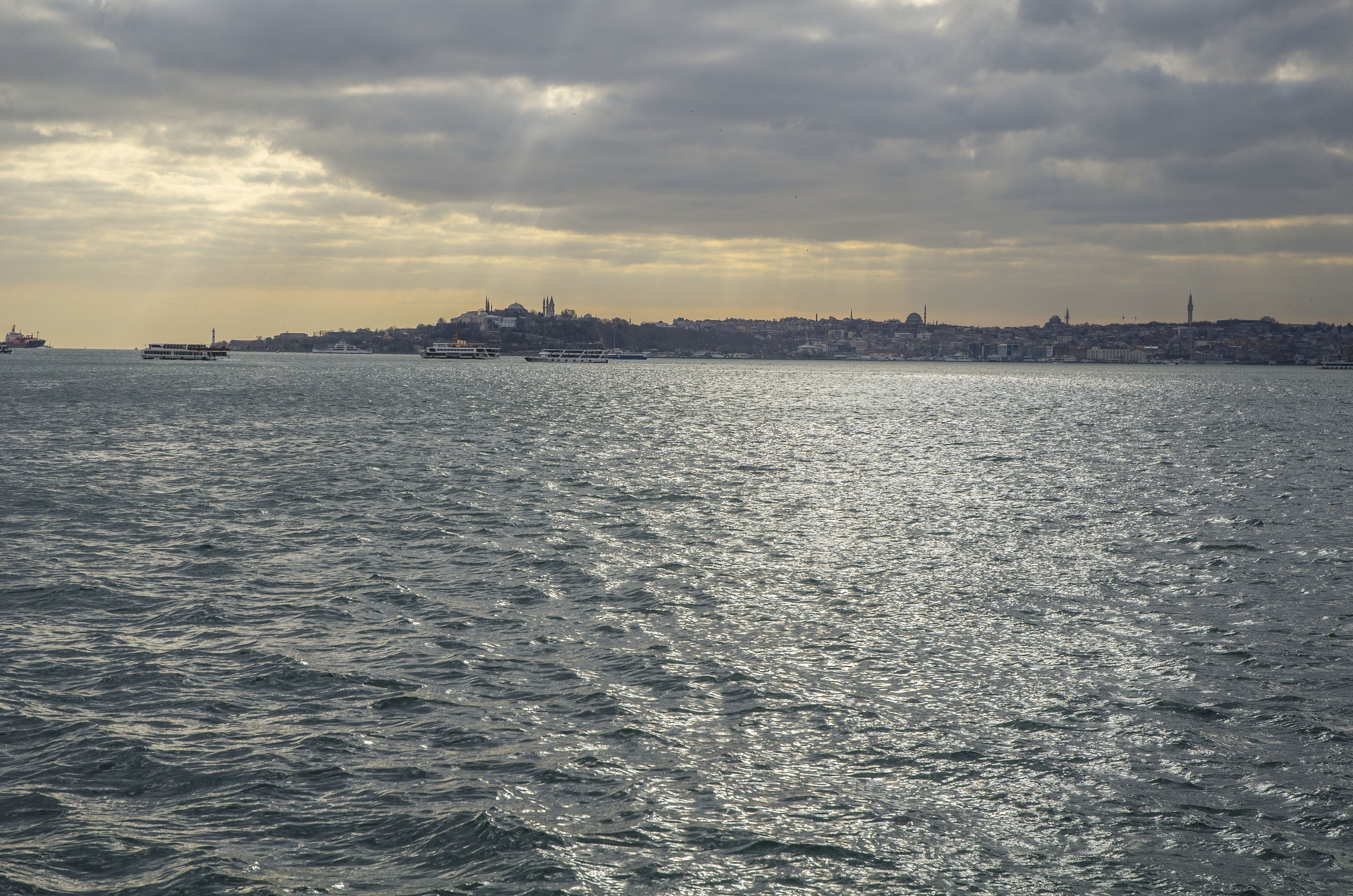 waterfront, sunset, city, light, cloud - sky, sea, tranquil scene, water, outdoors, sky, rippled, strait, istanbul, beauty in nature, nature, no people, HD Wallpaper