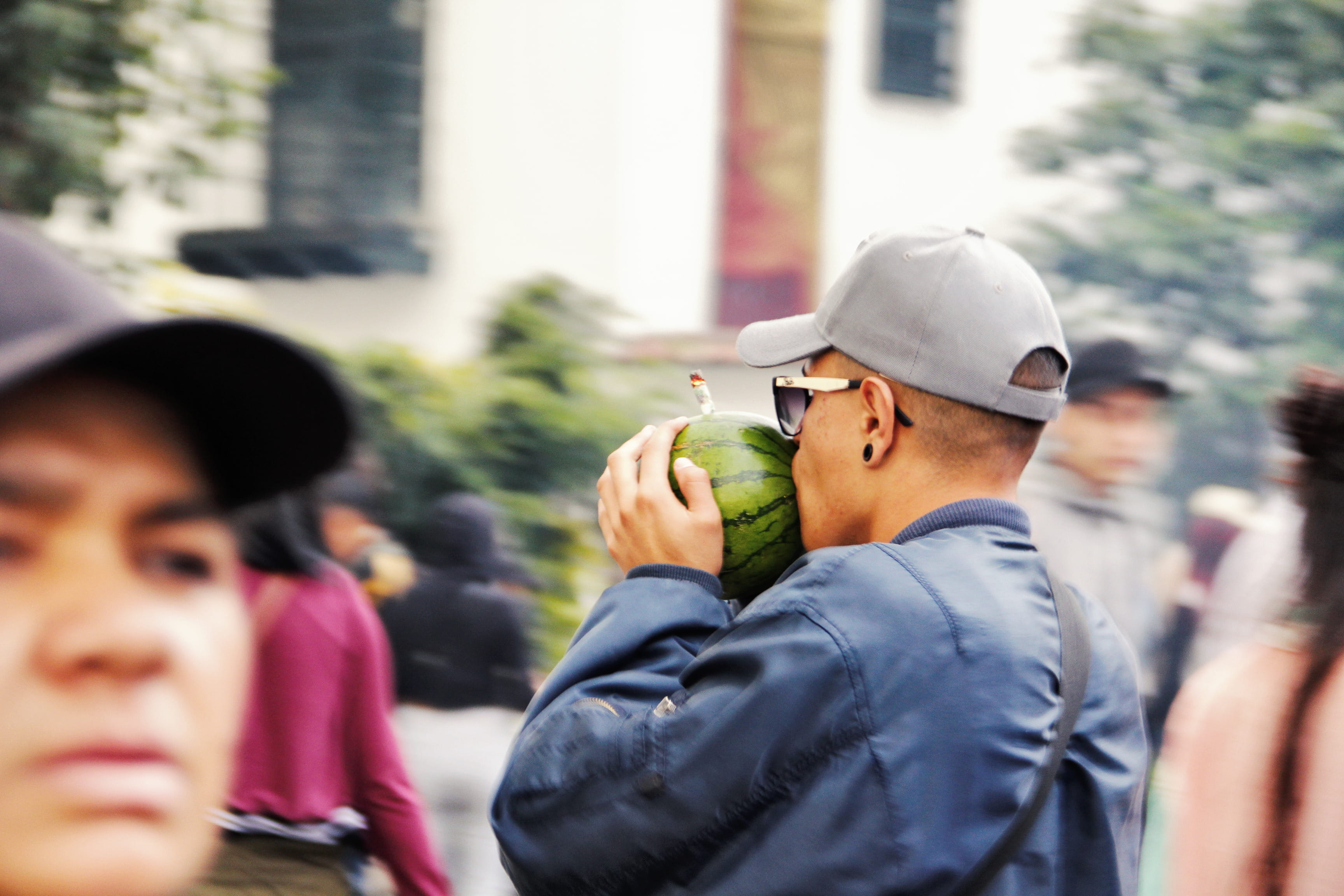 sunglasses, day, marihuana, selective focus, incidental people, glasses, portrait, outdoors, hat, men, architecture, 2K, people, street, young adult, real people, HD Wallpaper