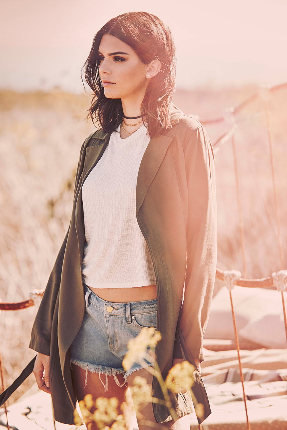 Kendall Jenner, looking into the distance, sunlight, dark hair, women outdoors, jean shorts, women, shoulder length hair, short shorts, standing, 720P, Phone HD Wallpaper