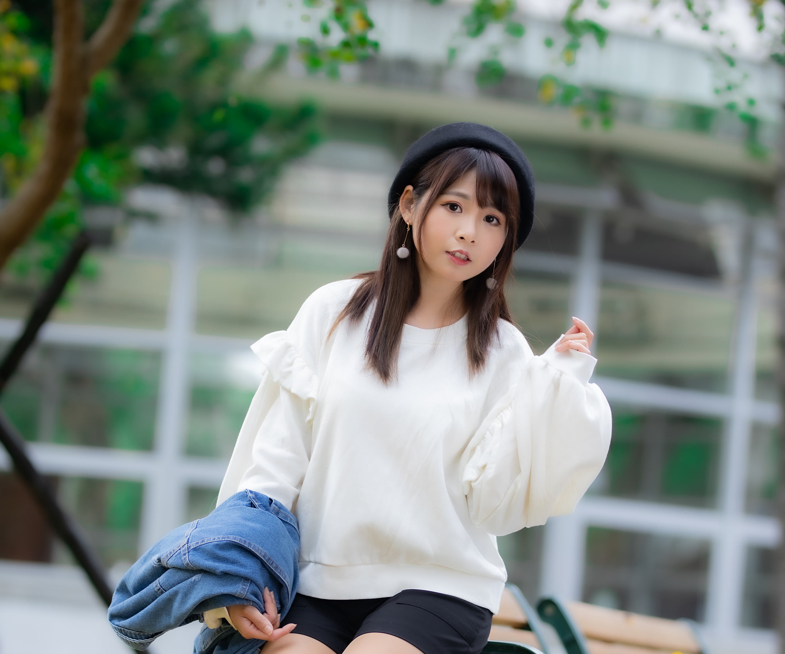 pullover, brunette, jeans jacket, earring, Asian, black shorts, model, long hair, trees, bench, 2K, berets, sitting, women, depth of field, HD Wallpaper