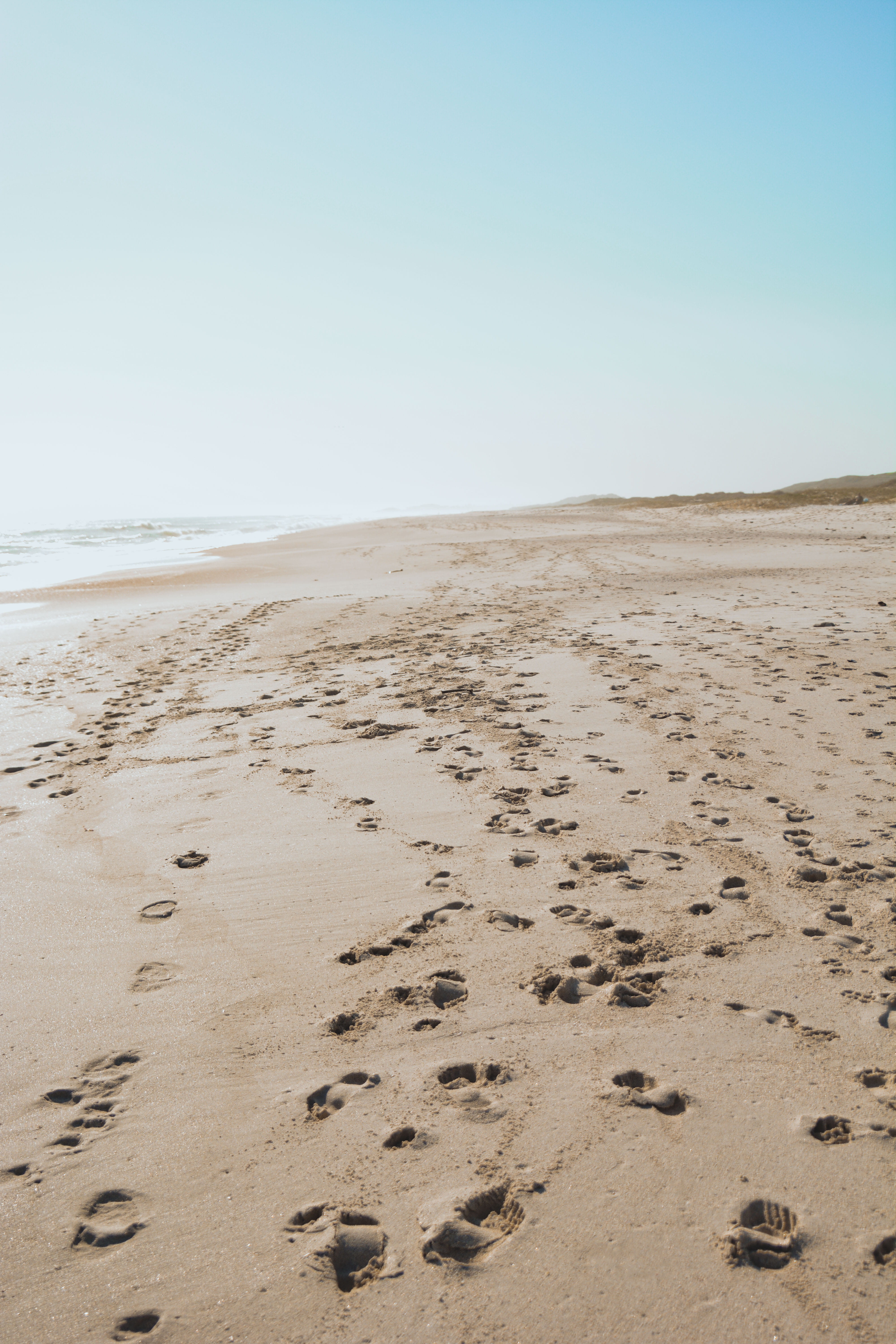 soil, ocean, tar, land, water, coast, sky, tranquility, scenics - nature, grey, climate, beach, promontory, shoreline, ground, environment, footprint, non-urban scene, Phone HD Wallpaper