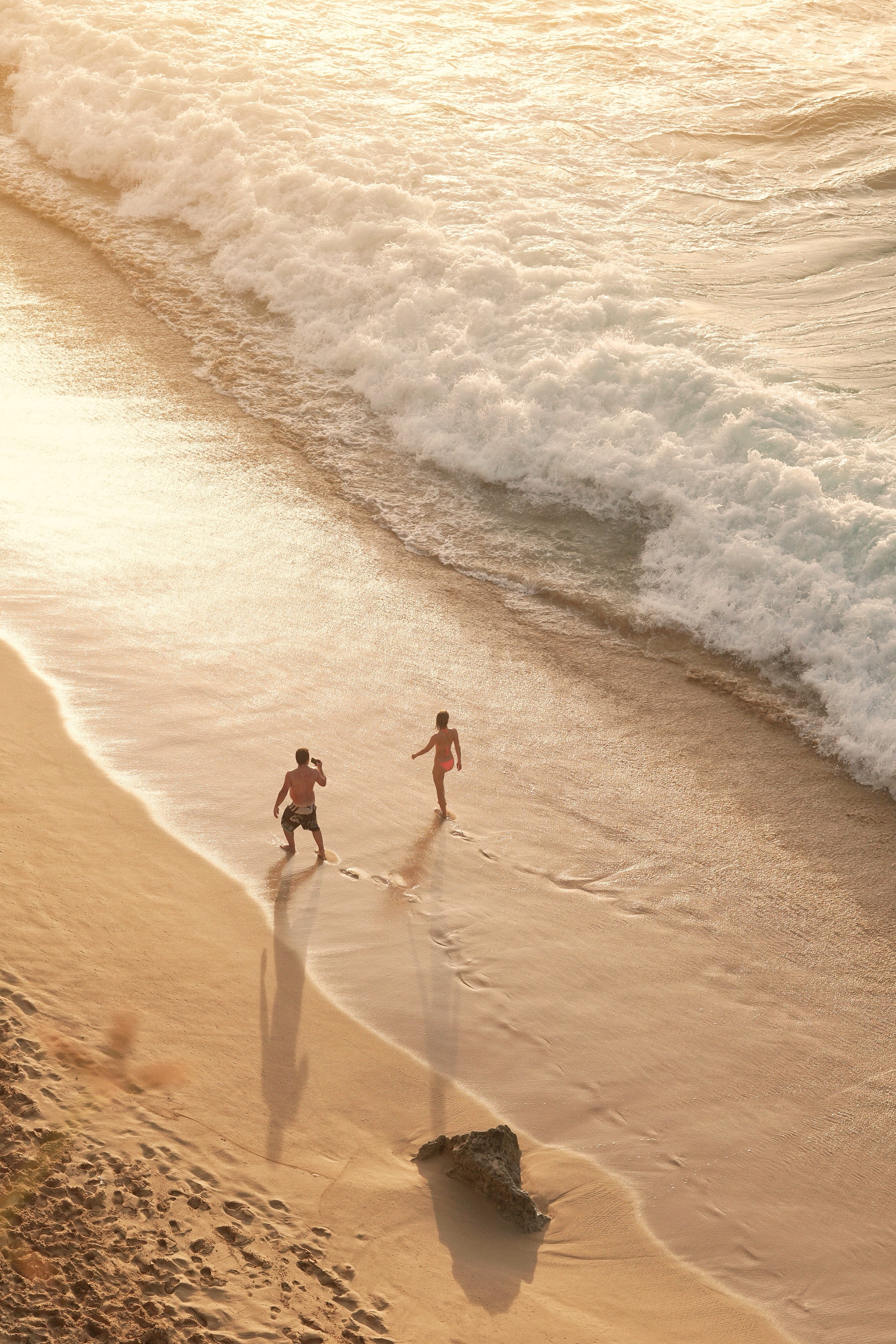 sea, outdoors, shore, footsteps, men, two, high angle view, trip, walking, sunset, beach, sand, nature, aquatic sport, lifestyles, shadow, seaside, 4K, Phone HD Wallpaper