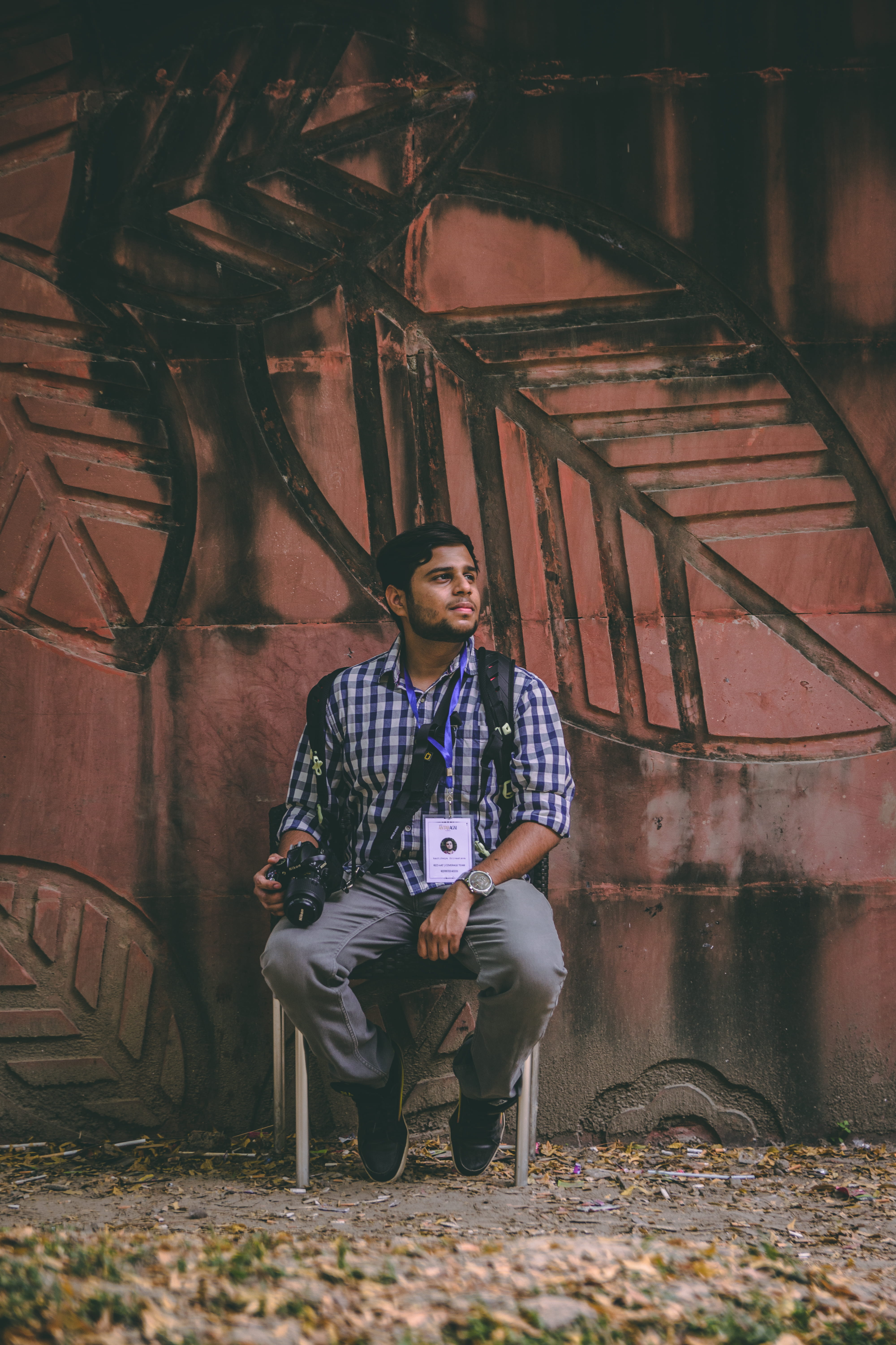 beside, holding, real people, indian institute of technology kanpur, shoe, person, standing, looking away, brick, one person, kanpur, sit, photographer, Phone HD Wallpaper