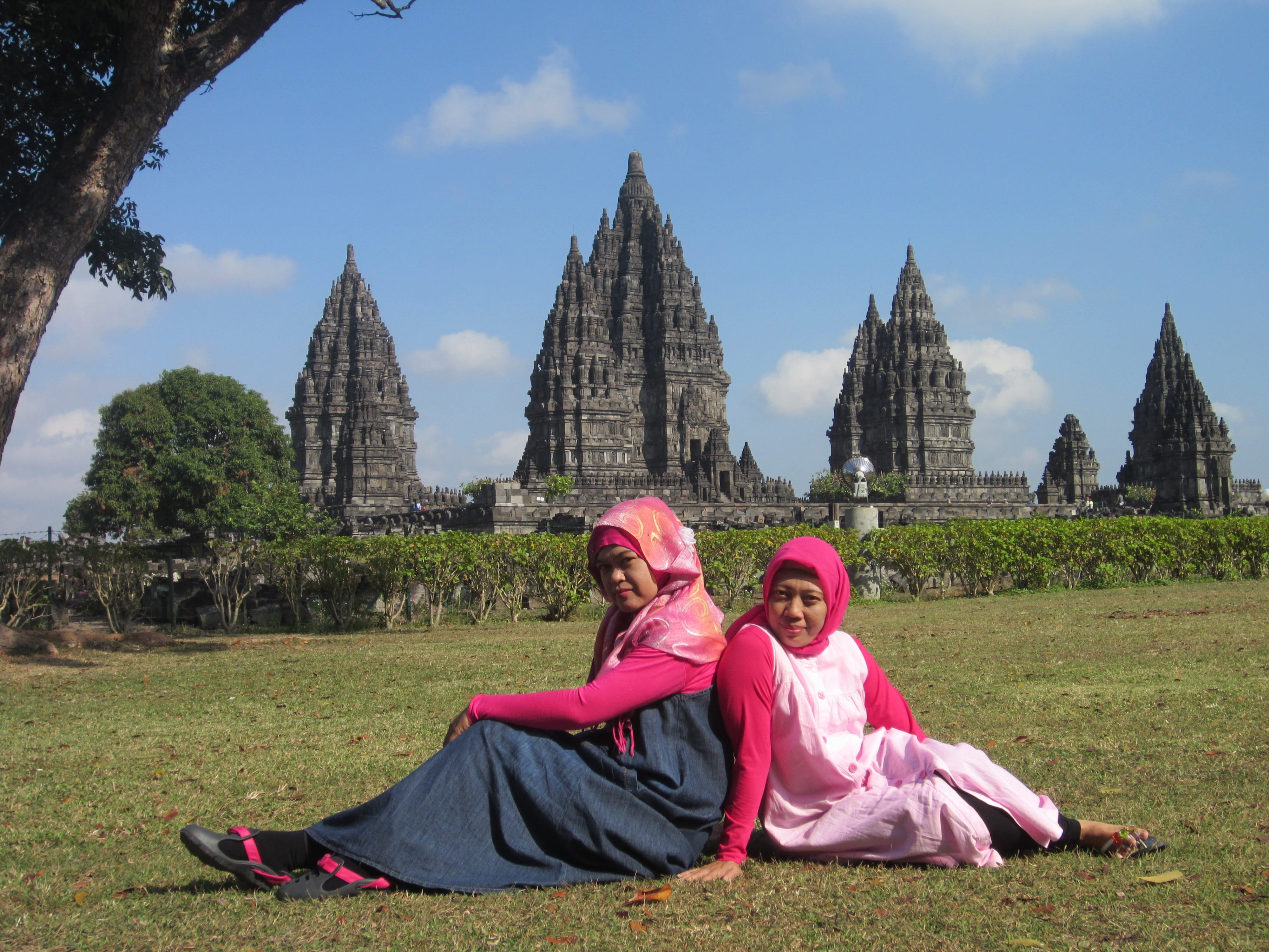 sitting, grass, cloud - sky, outdoors, friends, architecture, leisure activity, adult, lifestyles, two people, holidays, memorial day, prambanan temple, HD Wallpaper