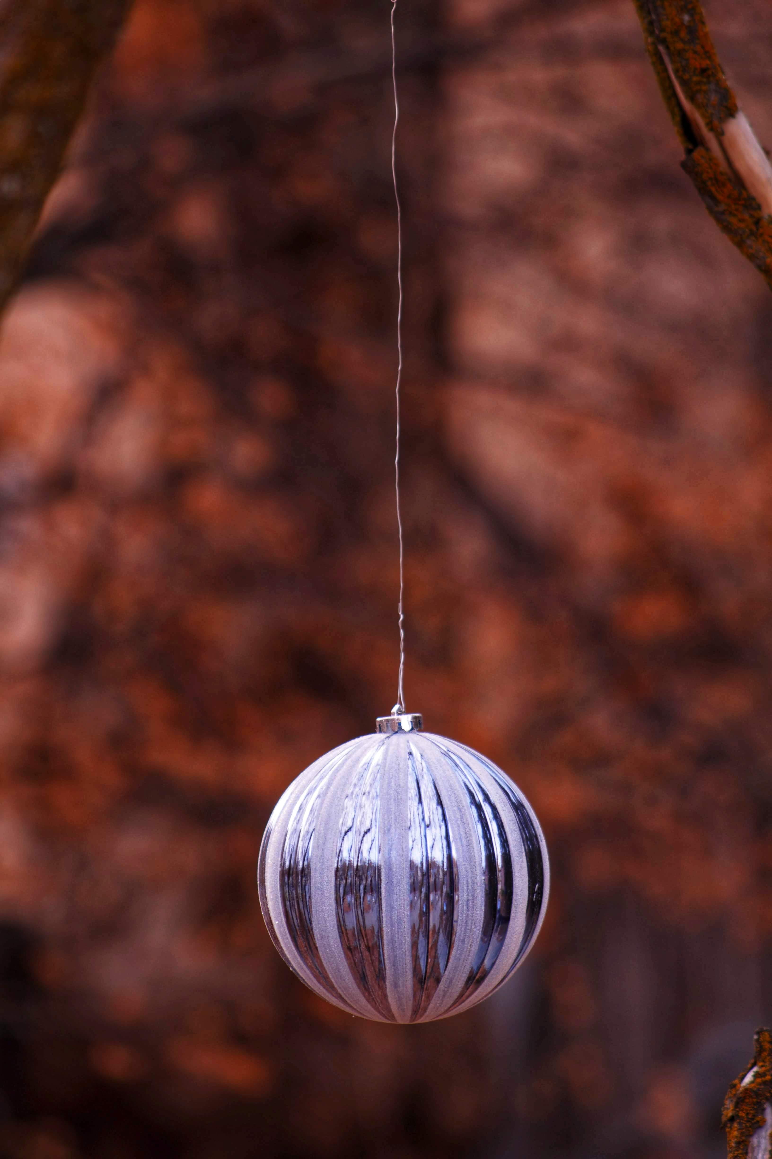 droplet, metal, shape, hole, string, light fixture, rust, chime, home decor, hardwood, focus on foreground, new, spiral, tree, fir, single object, nature, Phone HD Wallpaper