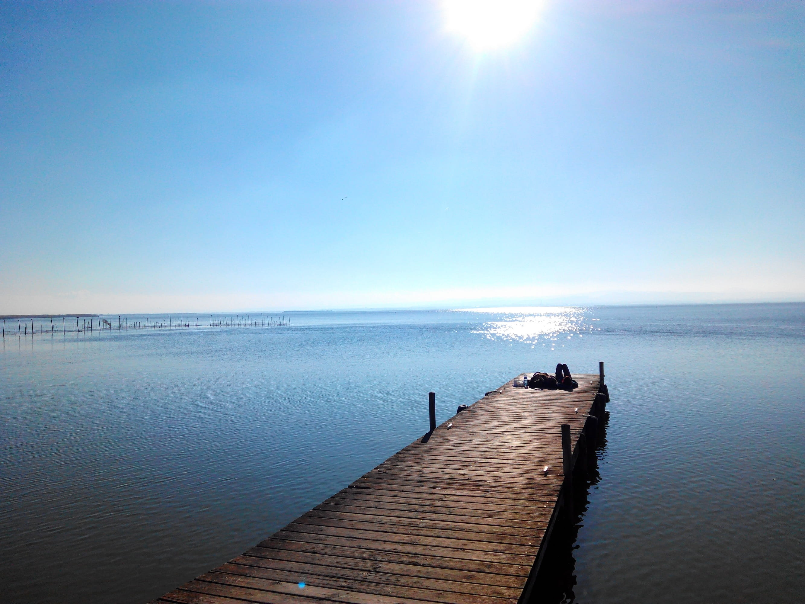 outdoors, sea, scenics, wood - material, reflection, sunlight, scenics - nature, relax, Valencia, ocean, clear sky, 2K, sunset, water, jetty, blue, sun, HD Wallpaper