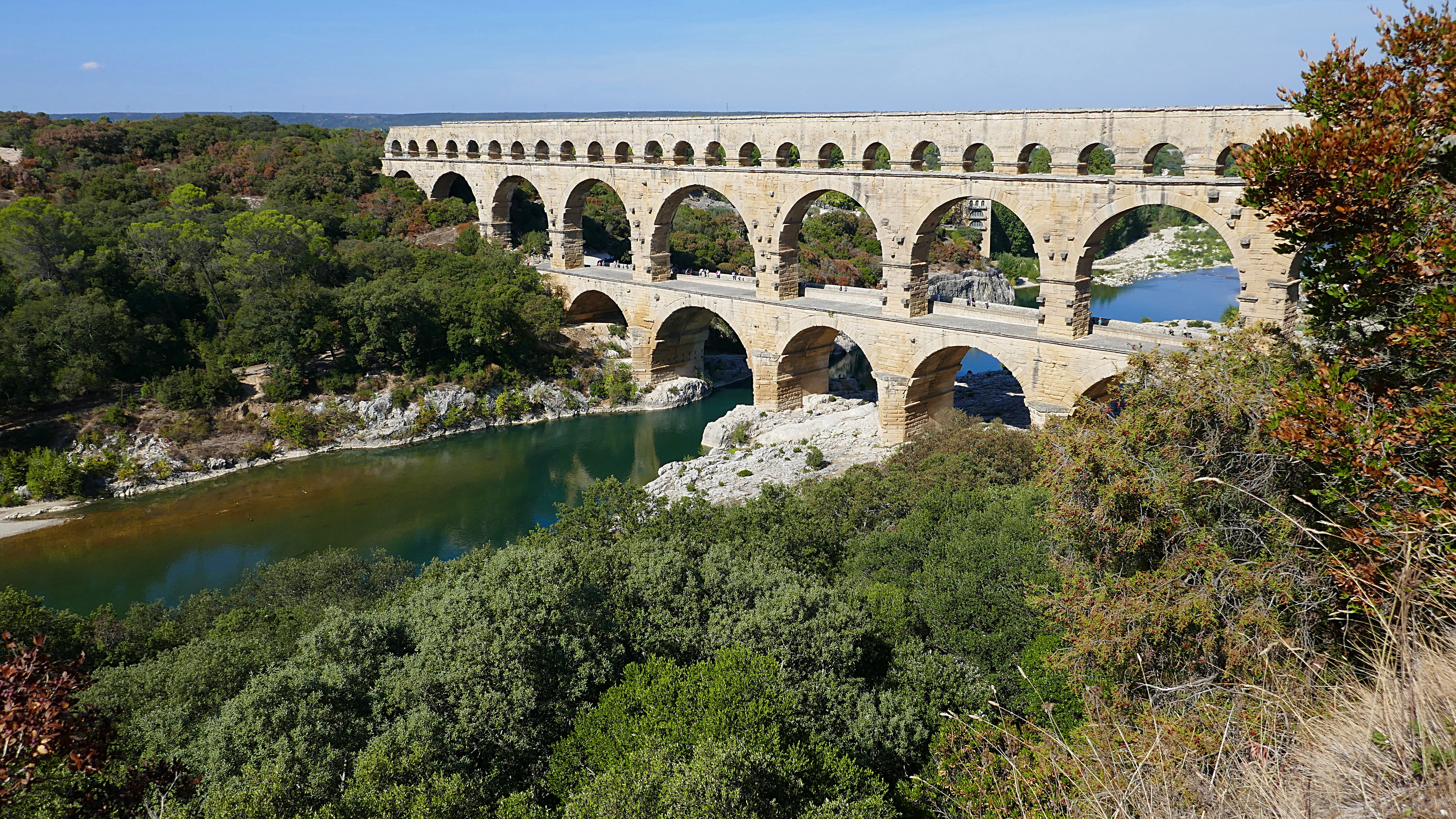 arch bridge, surrounded, roman, 5K, built structure, france, day, reflection, pont du gard, gray, water, history, bridge, outdoors, transportation, connection, HD Wallpaper