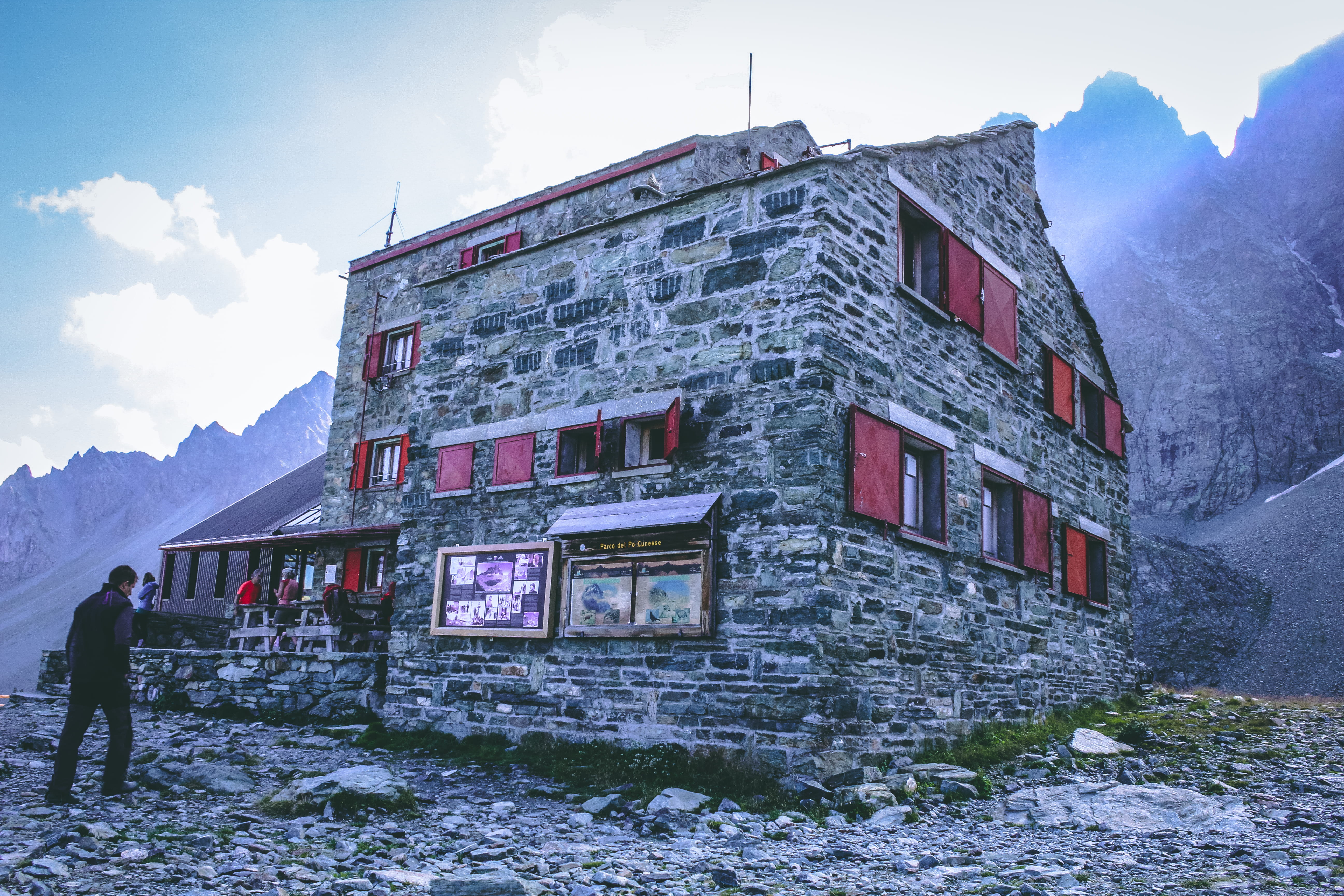 5K, facade, adventure, exterior, people, building, cloud - sky, men, landscape, built structure, mountains, leisure activity, gray, photo, rocks, front, HD Wallpaper