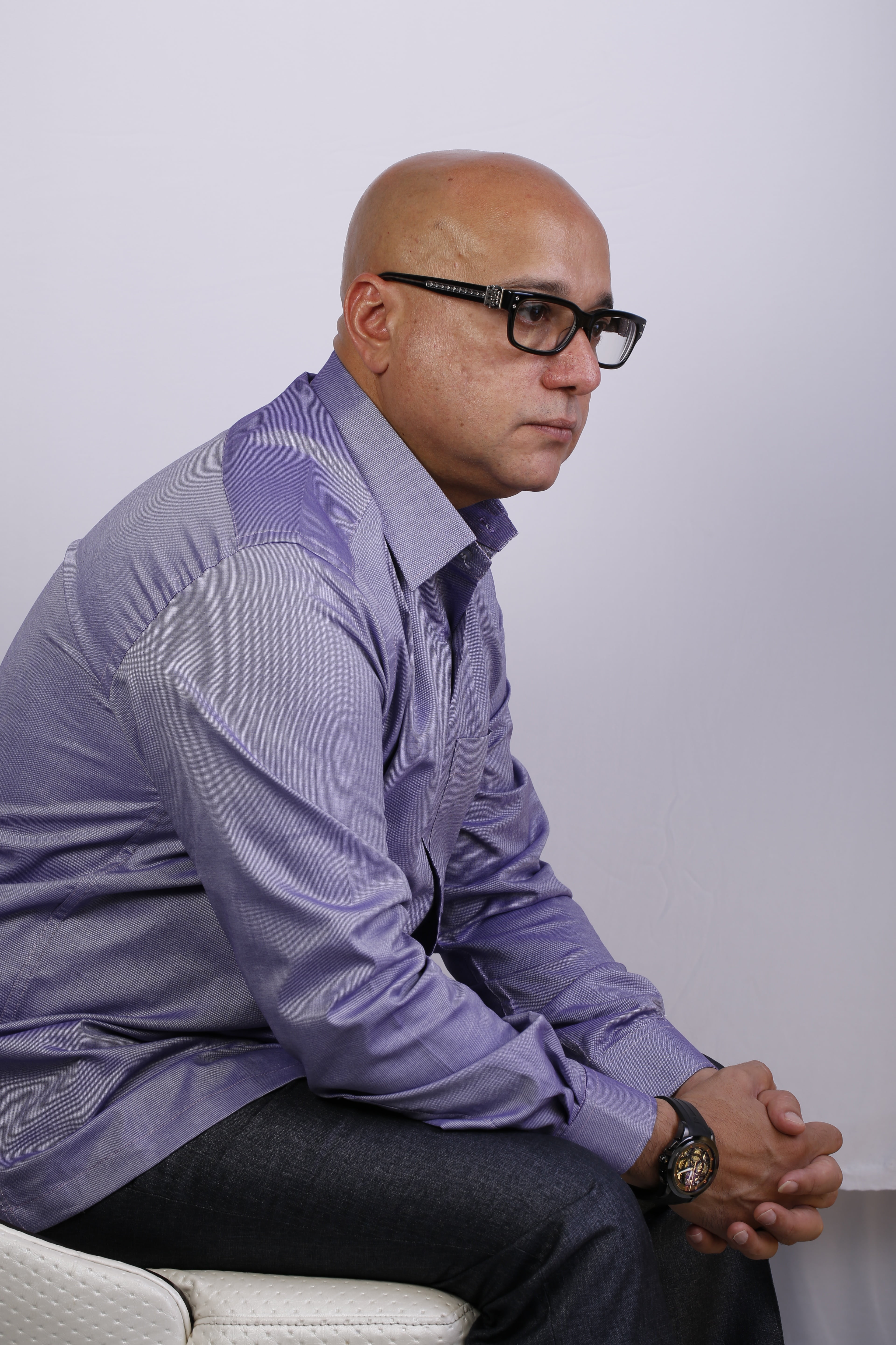 mature adult, person, one person, indoors, contemplation, sitting, serious, eyeglasses, clothing, three quarter length, shirt, man, indian, 5K, casual clothing, Phone HD Wallpaper