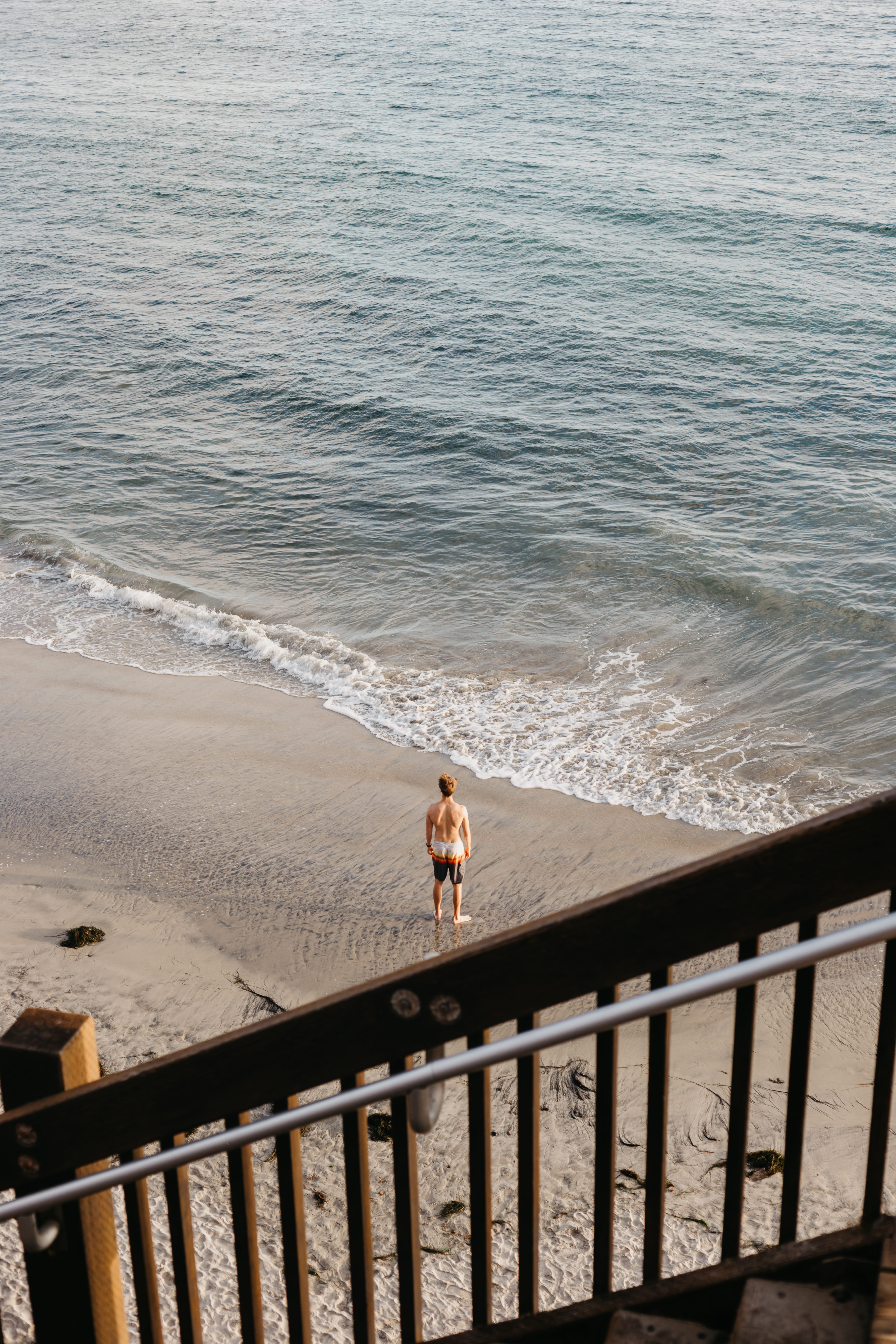 person, leisure activity, real people, promontory, 5K, human, one person, beauty in nature, day, transportation, beach, standing, man, seashore, sea, railing, Phone HD Wallpaper