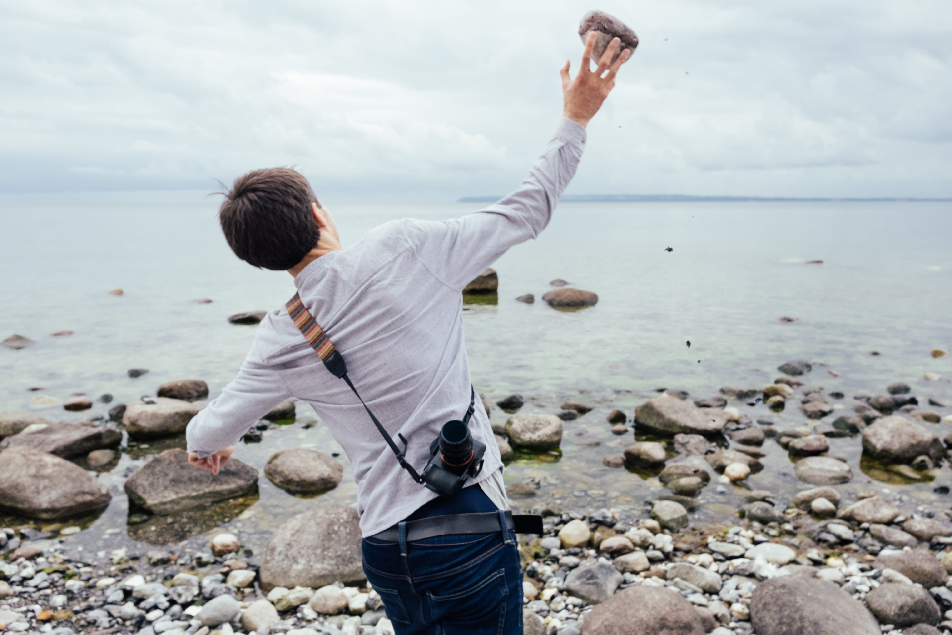 one person, solid, environment, stone, outdoors, splash, males, dom, man, casual clothing, fun, sea, lifestyle, male, adult, rear view, sky, nature, day, HD Wallpaper