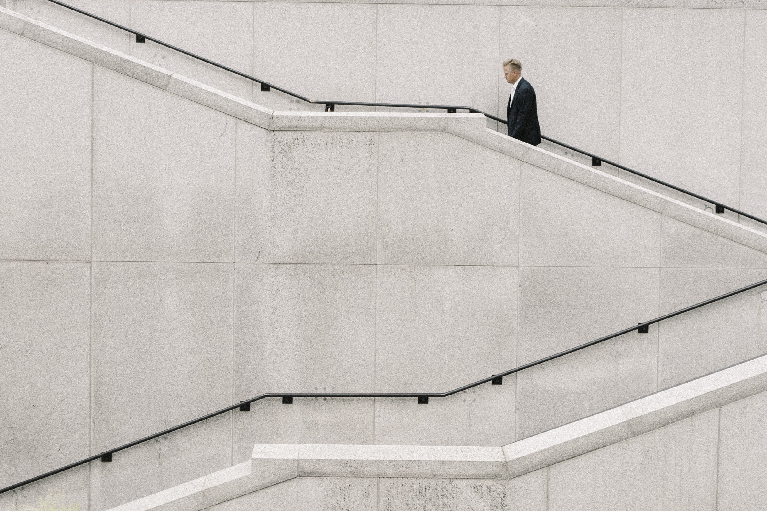 wall, beside, fashion, corporate business, copy space, railing, one person, people, stairs, males, steps and staircases, architecture, man, well-dressed, HD Wallpaper