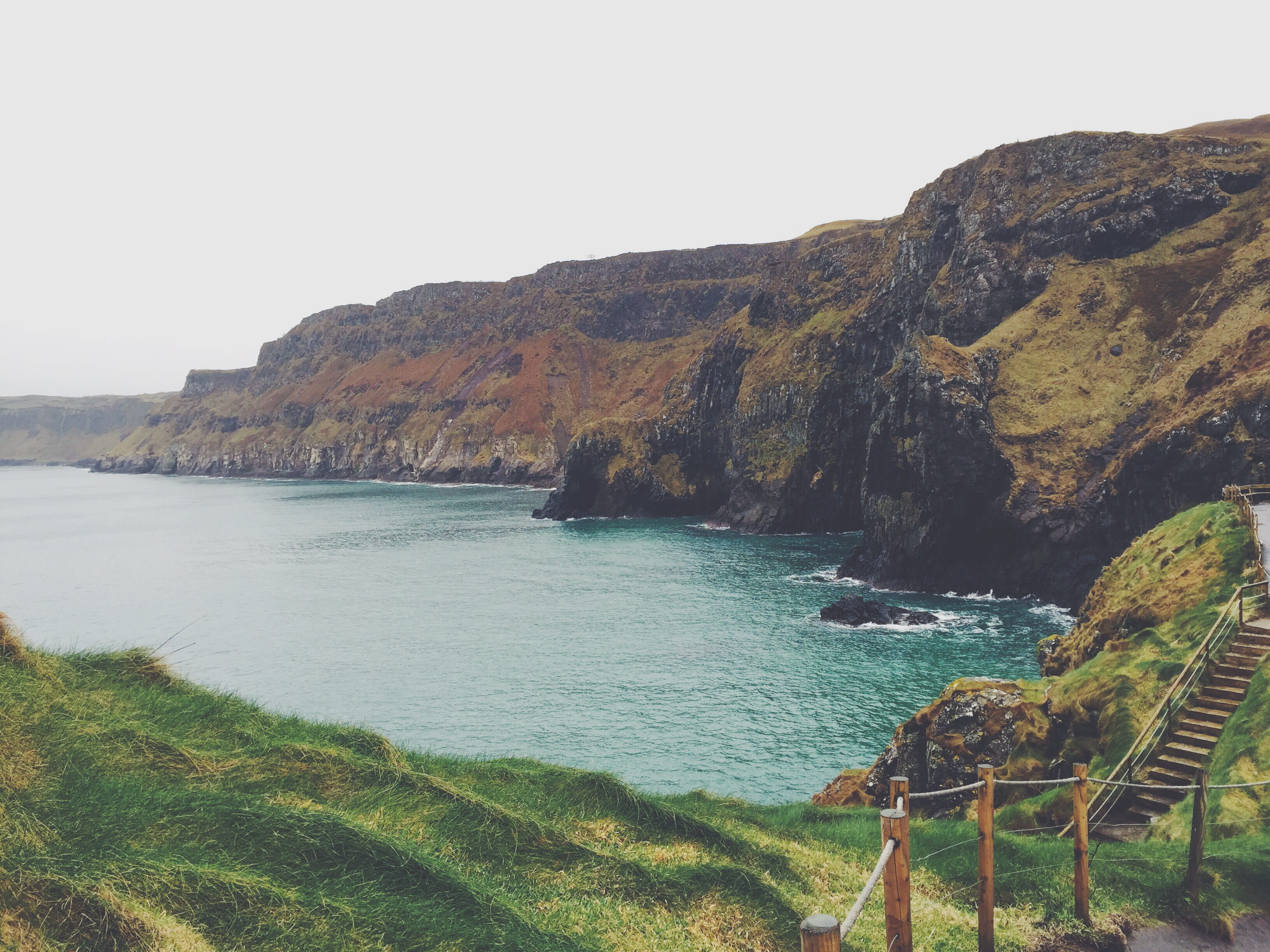 land, rock - object, solid, formation, united kingdom, tranquility, no people, beach, water, rock, outdoors, carrick-a-rede, 2K, beauty in nature, clear sky, HD Wallpaper