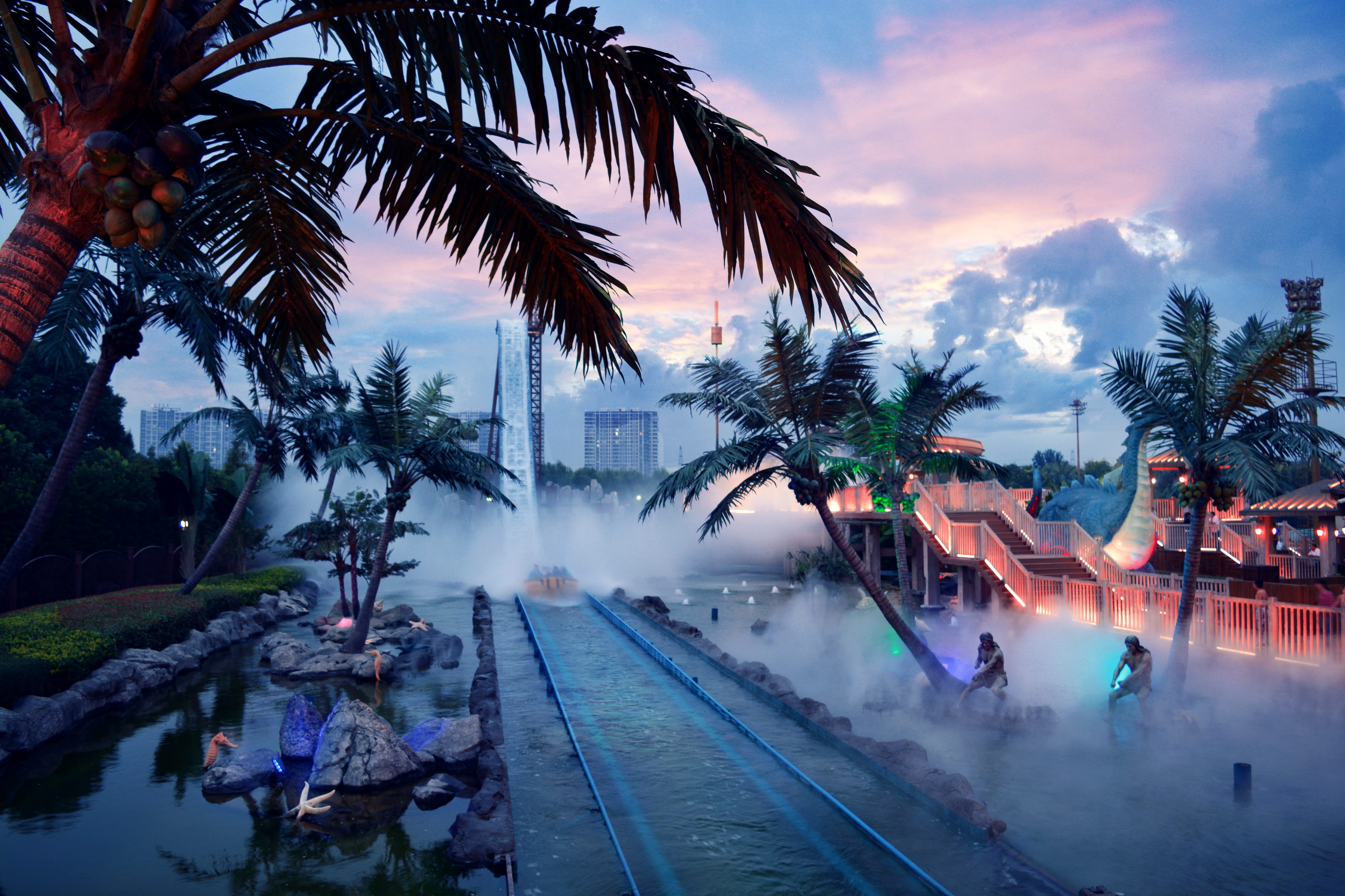 palm tree, Amusement Park, built structure, group of people, outdoors, railroad track, transportation, tree, dusk, motion, water, swimming pool, cloud - sky, HD Wallpaper