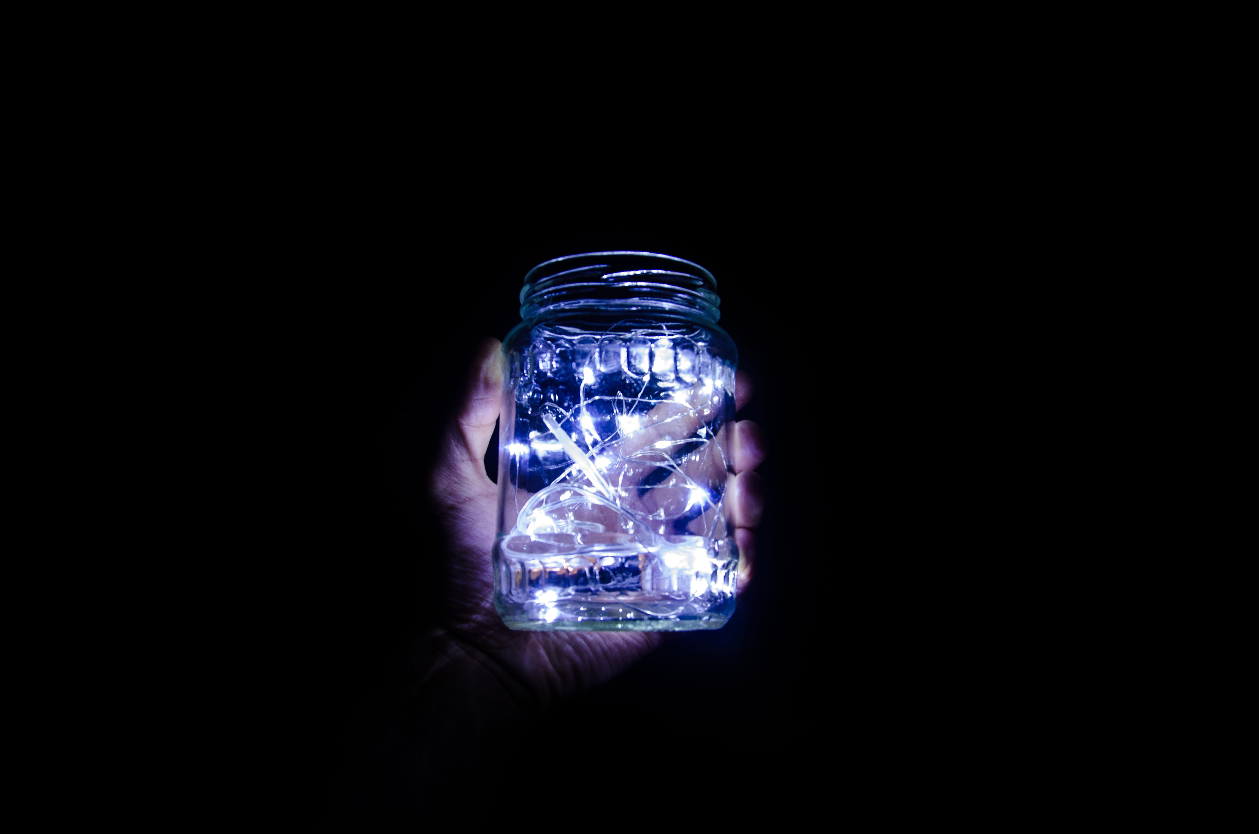 fairy light, 4K, holding, shiny, glass, person, light, dark, cold - Temperature, string, lights, reflection, hand, single Object, transparent, jar, nature, HD Wallpaper