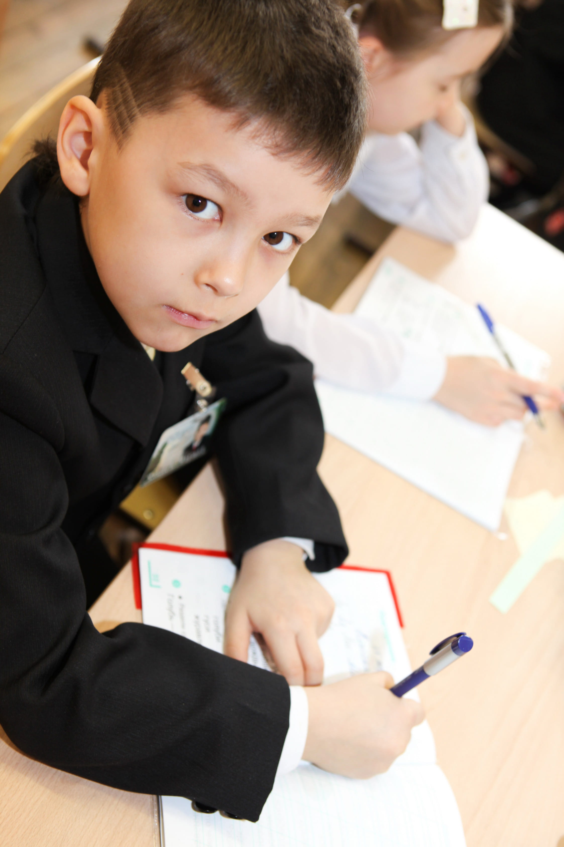 paper, kid, classroom, indoors, schoolboy, school supplies, school, son, educational, focus on foreground, education, 2K, sitting, uniform, men, innocence, Phone HD Wallpaper