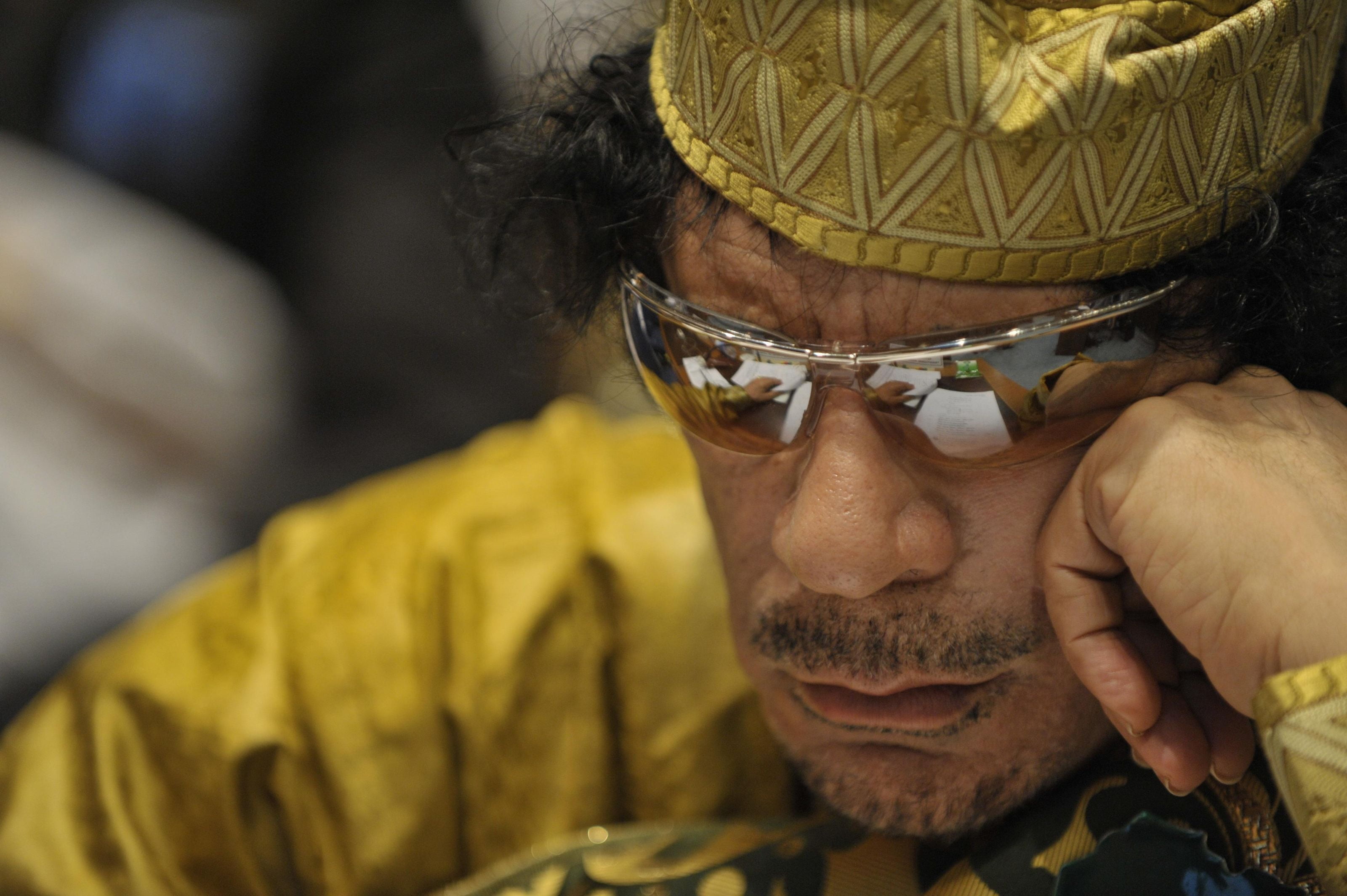 mid adult men, glasses, real people, occupation, Moammar Gadhafi, the leader, males, headshot, looking, close-up, front view, fashion, portrait, 2K, yellow, HD Wallpaper
