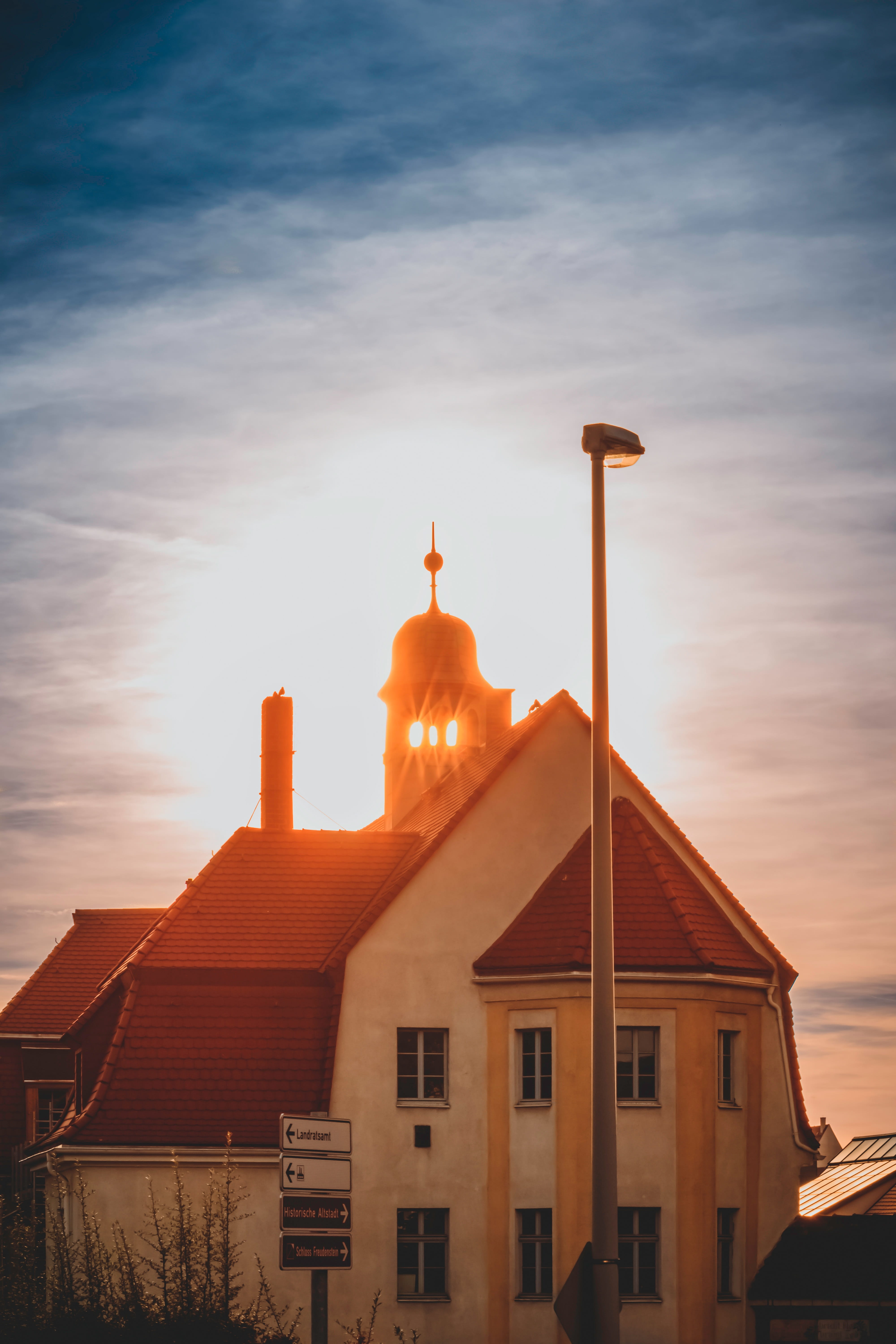 building exterior, sunlight, saxony, 5K, places of interest, germany, nature, belief, low angle view, spirituality, backlighting, architecture, orange color, Phone HD Wallpaper