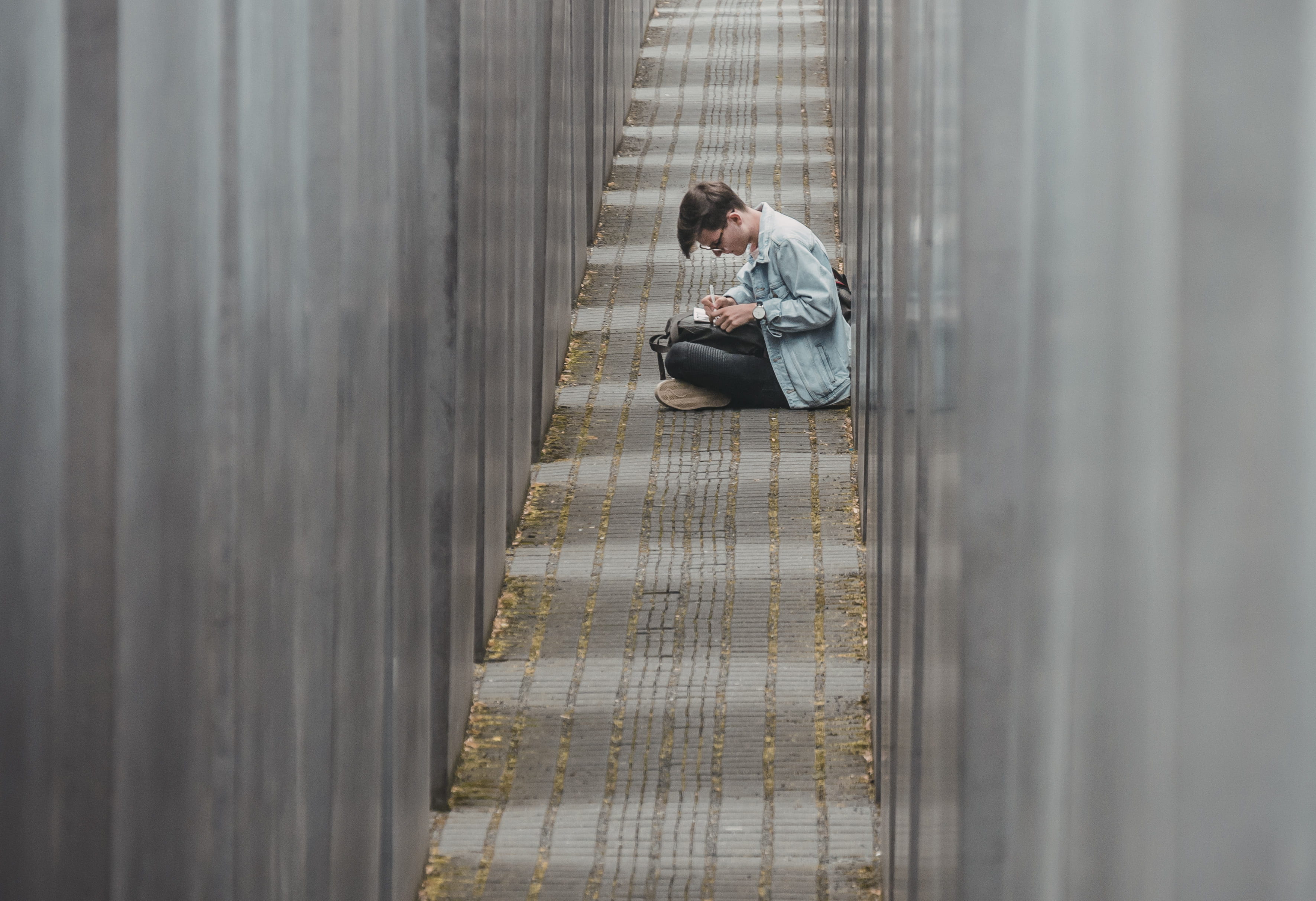 pathway, germany, jeans, boy, wall, writing, concrete, berlin, casual clothing, blue, architecture, glass, side view, young men, depression - sadness, one person, HD Wallpaper