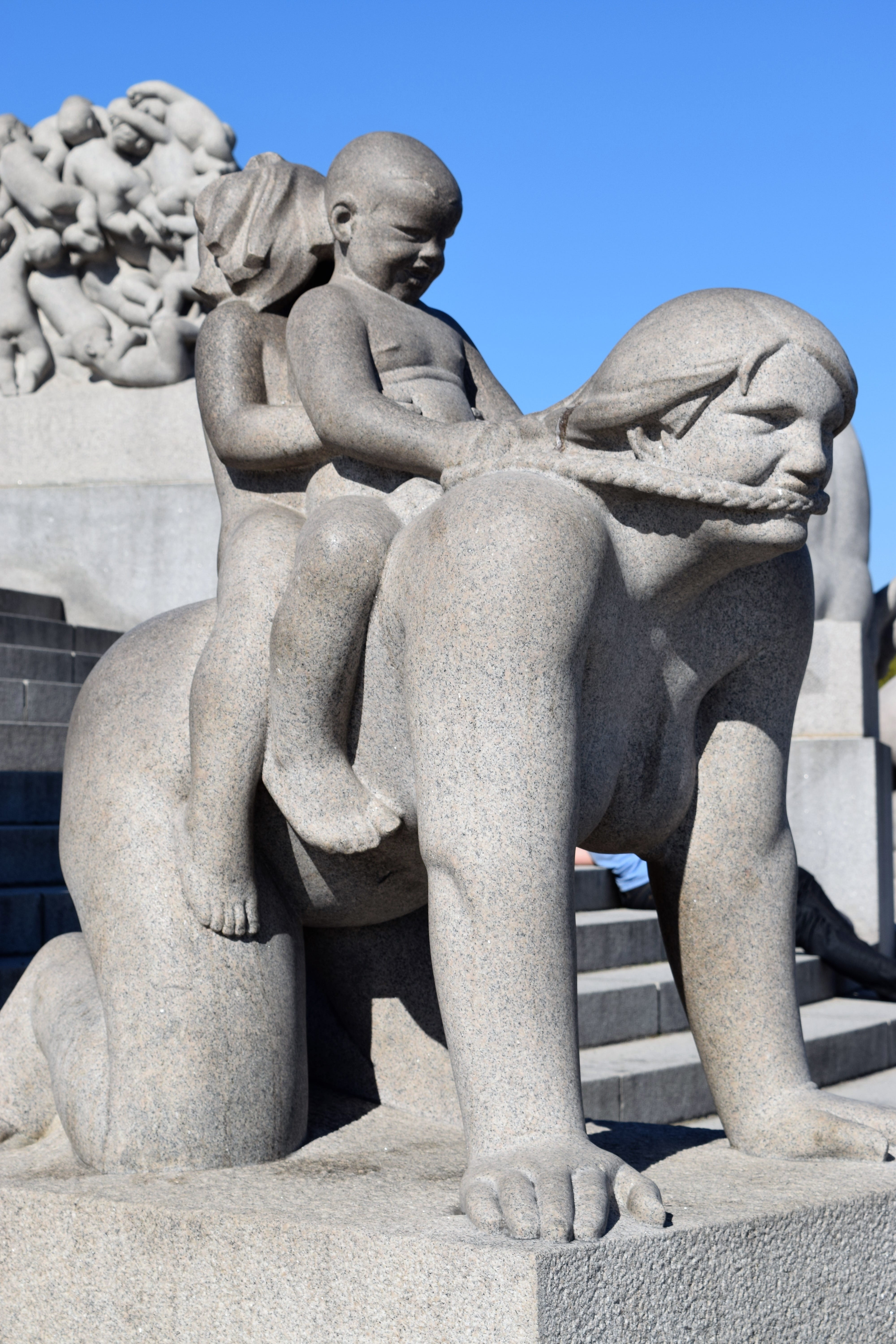male likeness, vigeland, riding, clear sky, children, play, sunlight, outdoor, close-up, burden, human representation, family, statue, Oslo, creativity, Phone HD Wallpaper