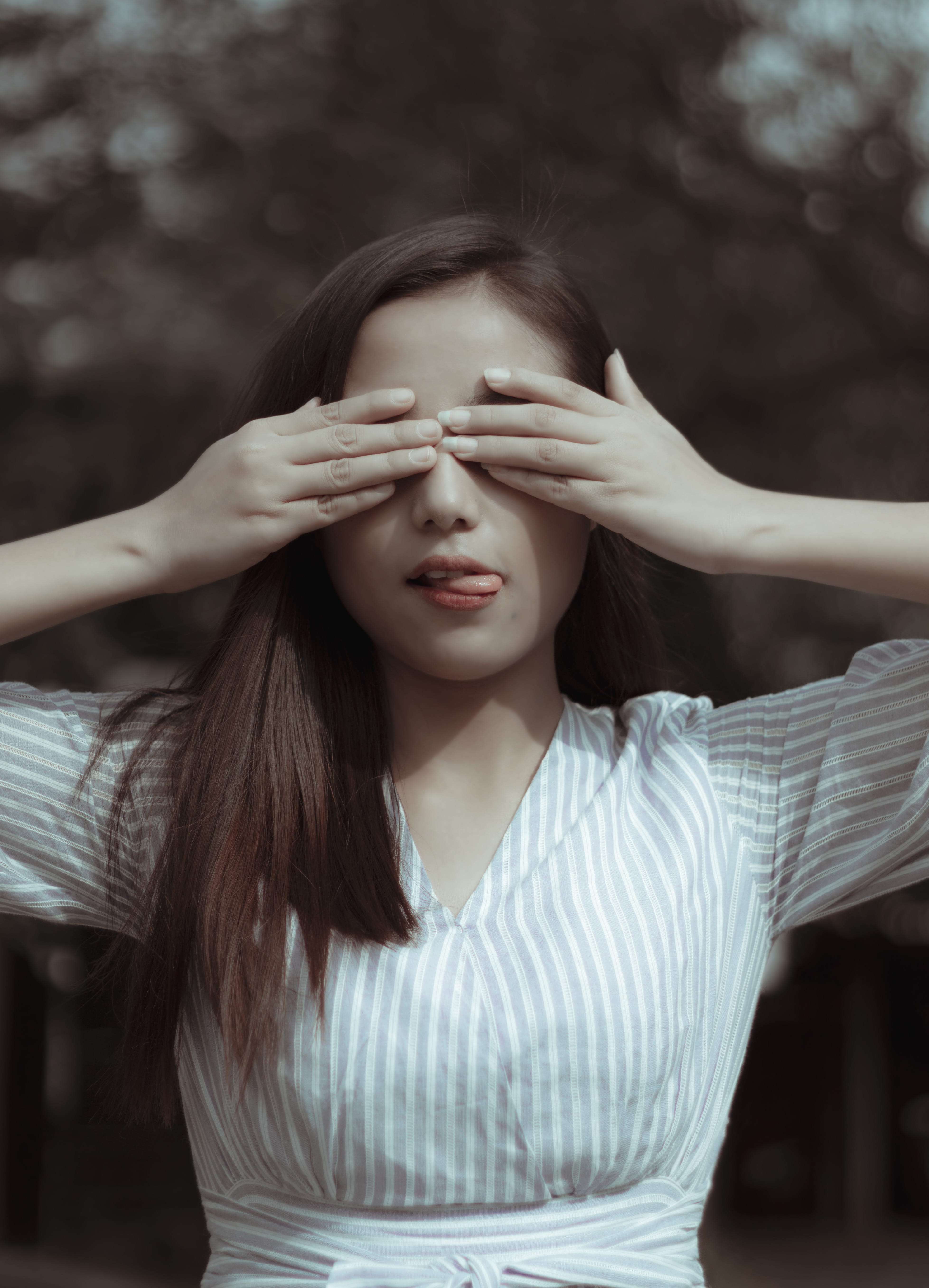 covering, obscured face, model, beautiful woman, young adult, vintage, tongue out, moody, female, hair, brunette, woman, day, focus, leisure activity, style, Phone HD Wallpaper