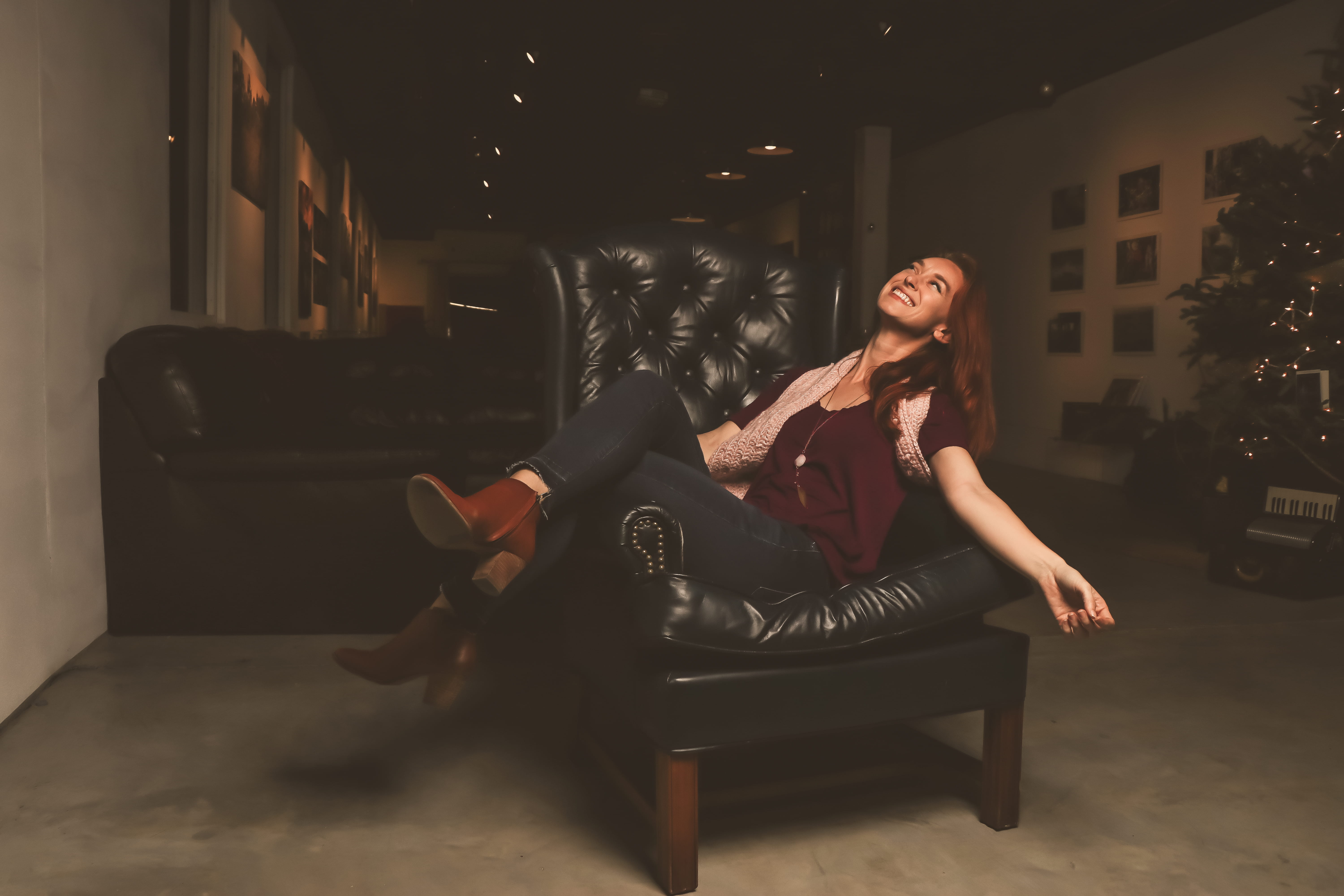 armchair, full length, indoors, young women, furniture, lifestyle, leather boots, wear, adult, face, relaxation, beautiful woman, sit, office, scarf, sofa, HD Wallpaper