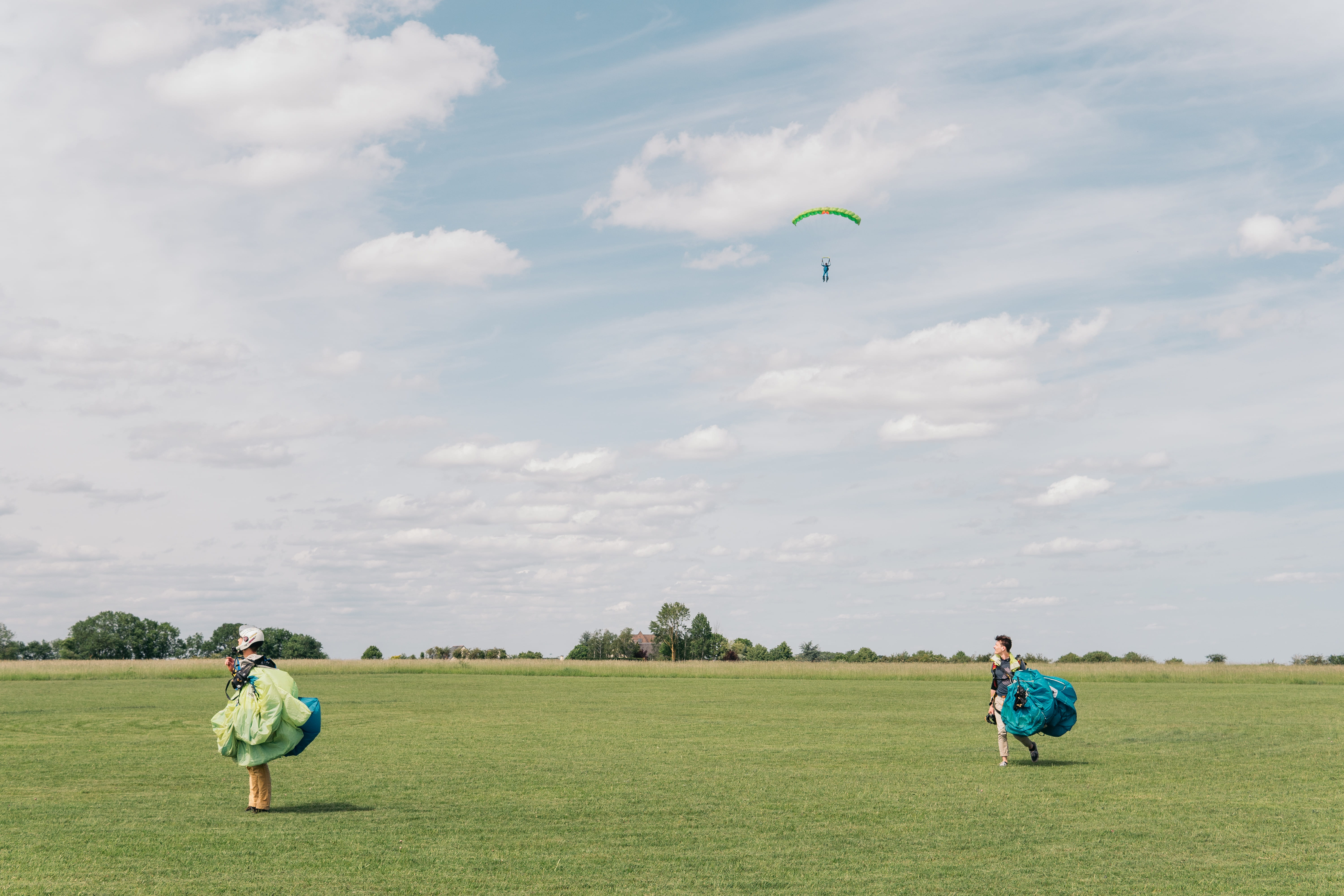 sky, adventure, saumur, men, france, cloud - sky, sport, day, extreme sports, lifestyles, grass, parachute, green color, blue sky, outdoors, field, paragliding, HD Wallpaper