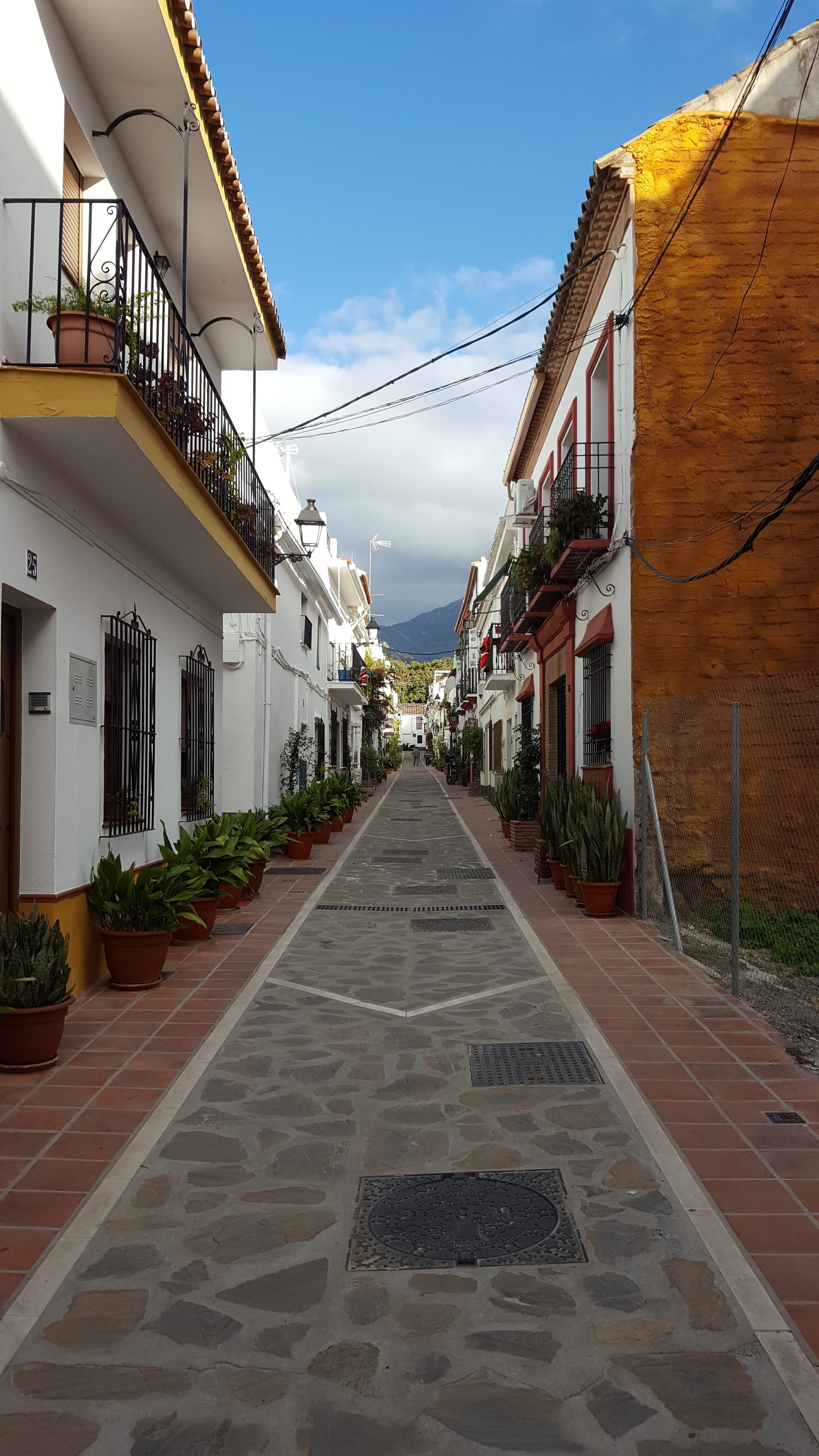 direction, spain, vanishing point, the way forward, alley, outdoors, lane, travel, house, 5K, building, andalusia, city, tourism, sky, plant, marbella, Phone HD Wallpaper