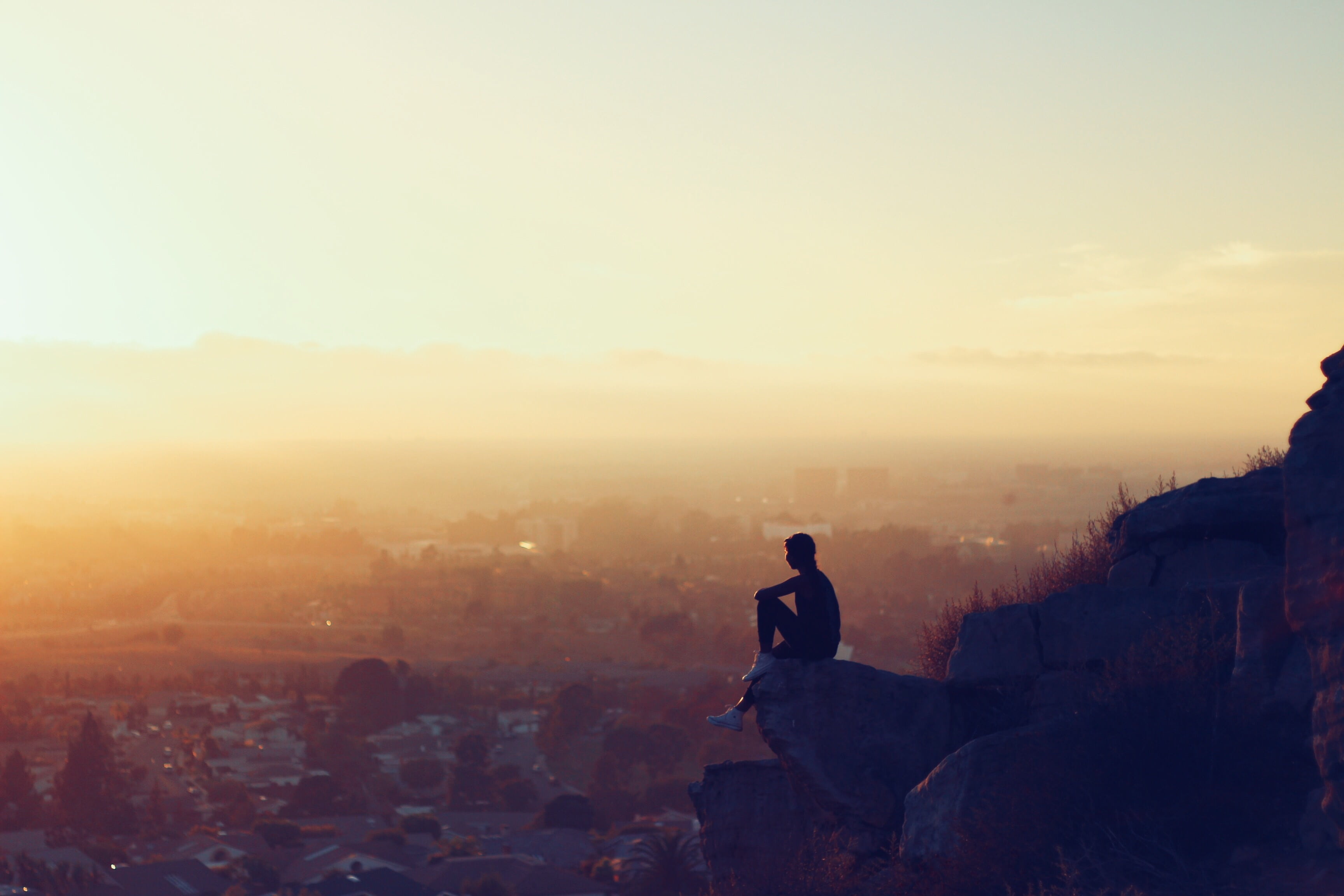 landscape, looking at view, girl, city, rock, building exterior, mountain, valley, nature, outdoors, cliff, real people, cityscape, architecture, sunset, HD Wallpaper