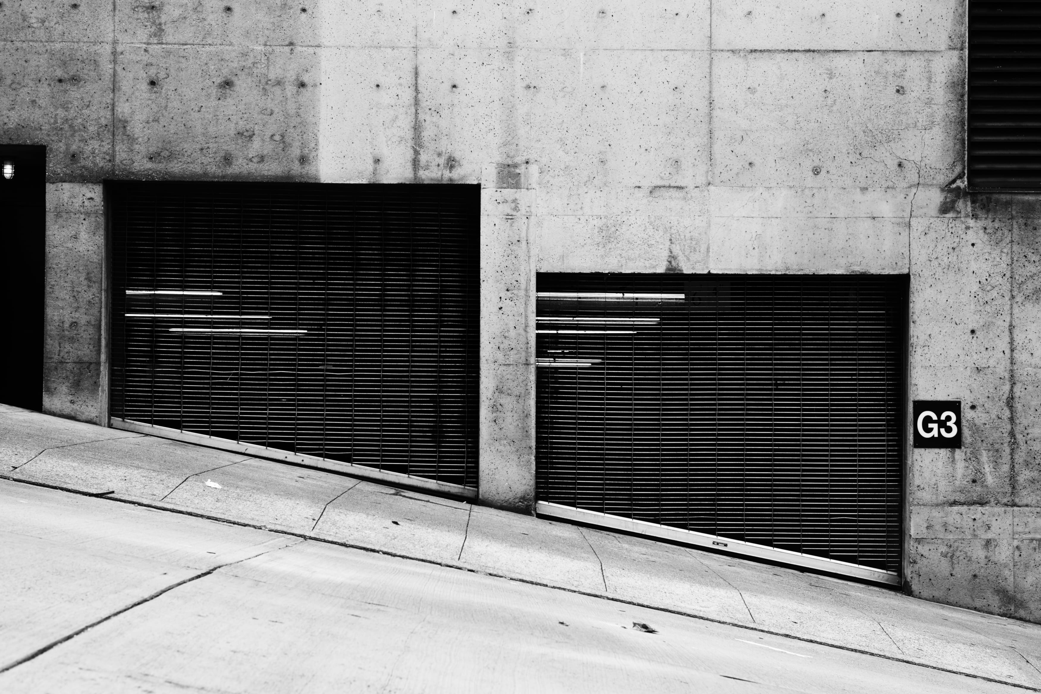 shutter, wall - building feature, protection, urban Scene, g, city, pavement, parking garage, black metal, closed, sidewalk, wall, footpath, urban, abandoned, HD Wallpaper