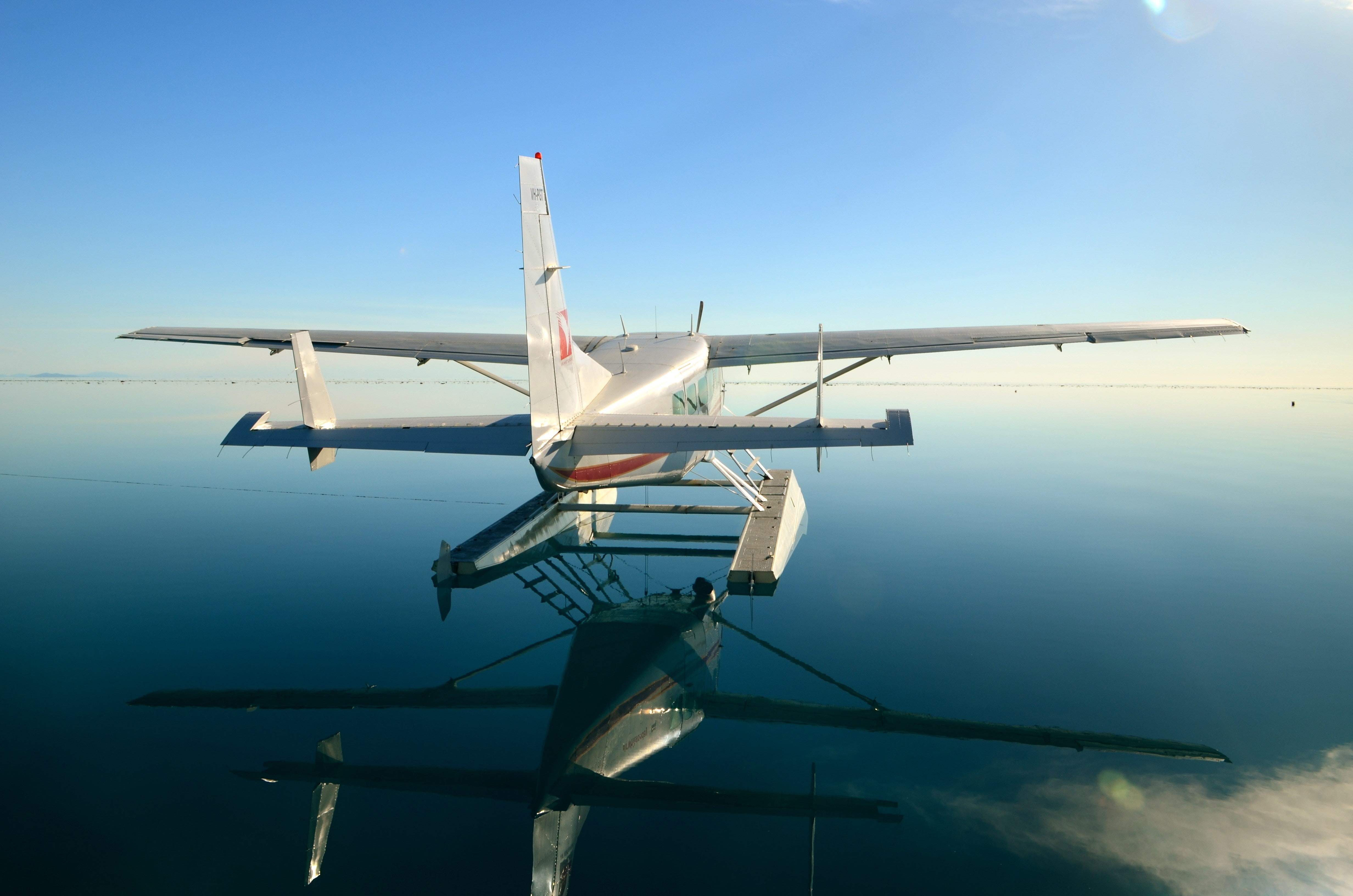 water, day, 4K, air vehicle, airplane, mid-air, cessna, sky, blue, travel, motion, nature, aerospace industry, on the move, technology, flying, clear sky, HD Wallpaper
