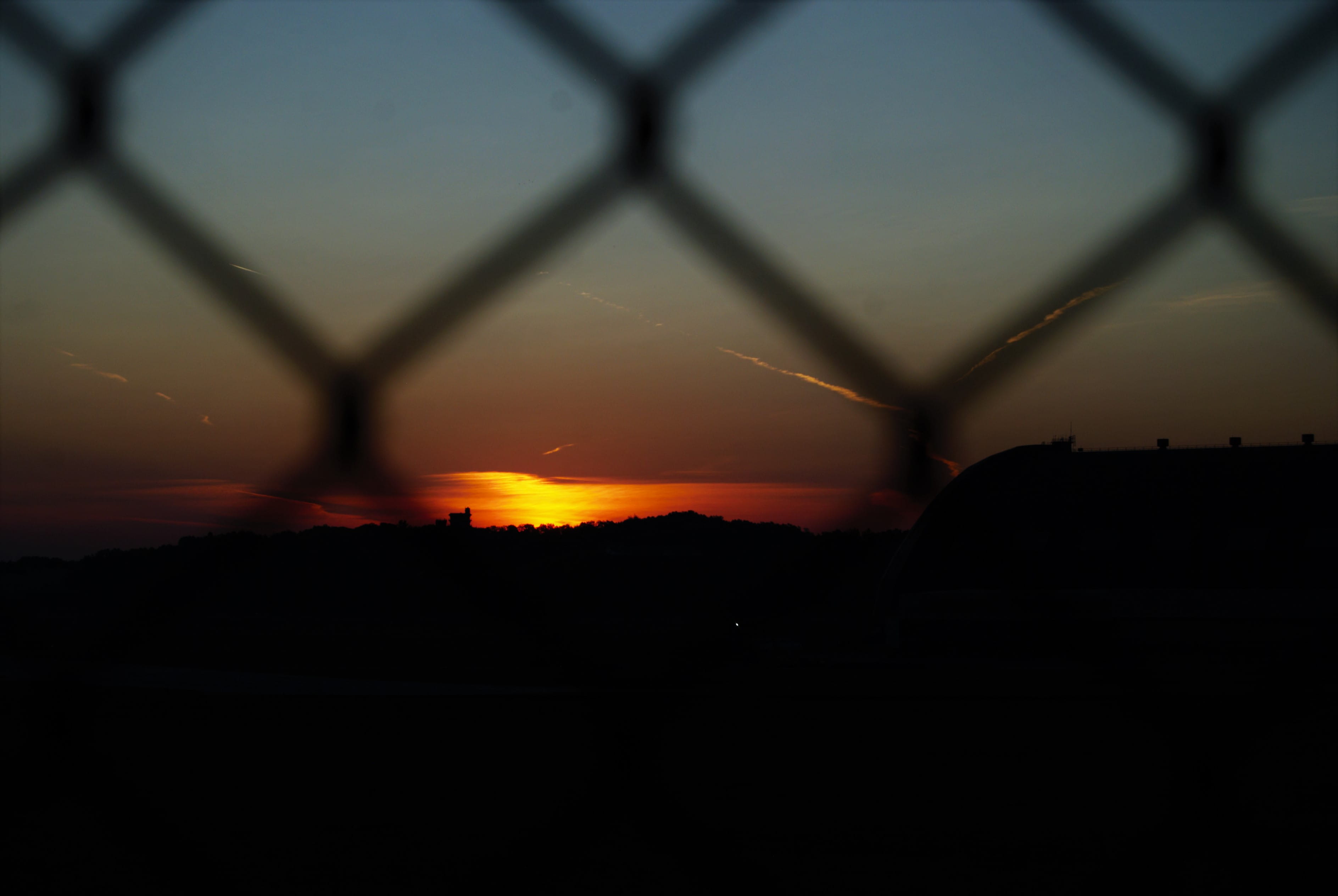 building exterior, morning, hanger, barrier, security, fence, early, metal, beauty in nature, chainlink, akron fulton international airport, sunset, nature, HD Wallpaper