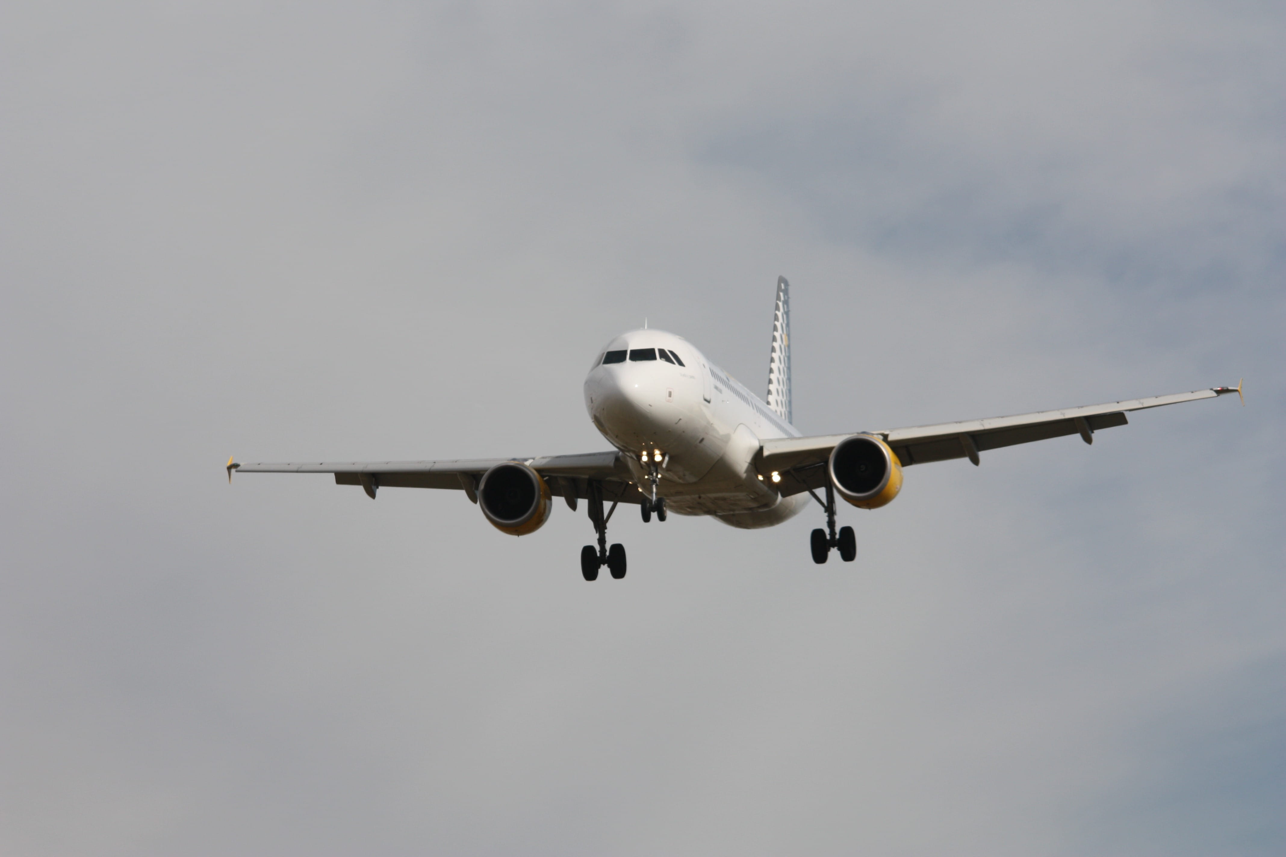 outdoors, daytime, airplane, aerospace industry, travel, air vehicle, sky, journey, leaving, transportation, Vueling, commercial airplane, arrival, low angle view, HD Wallpaper