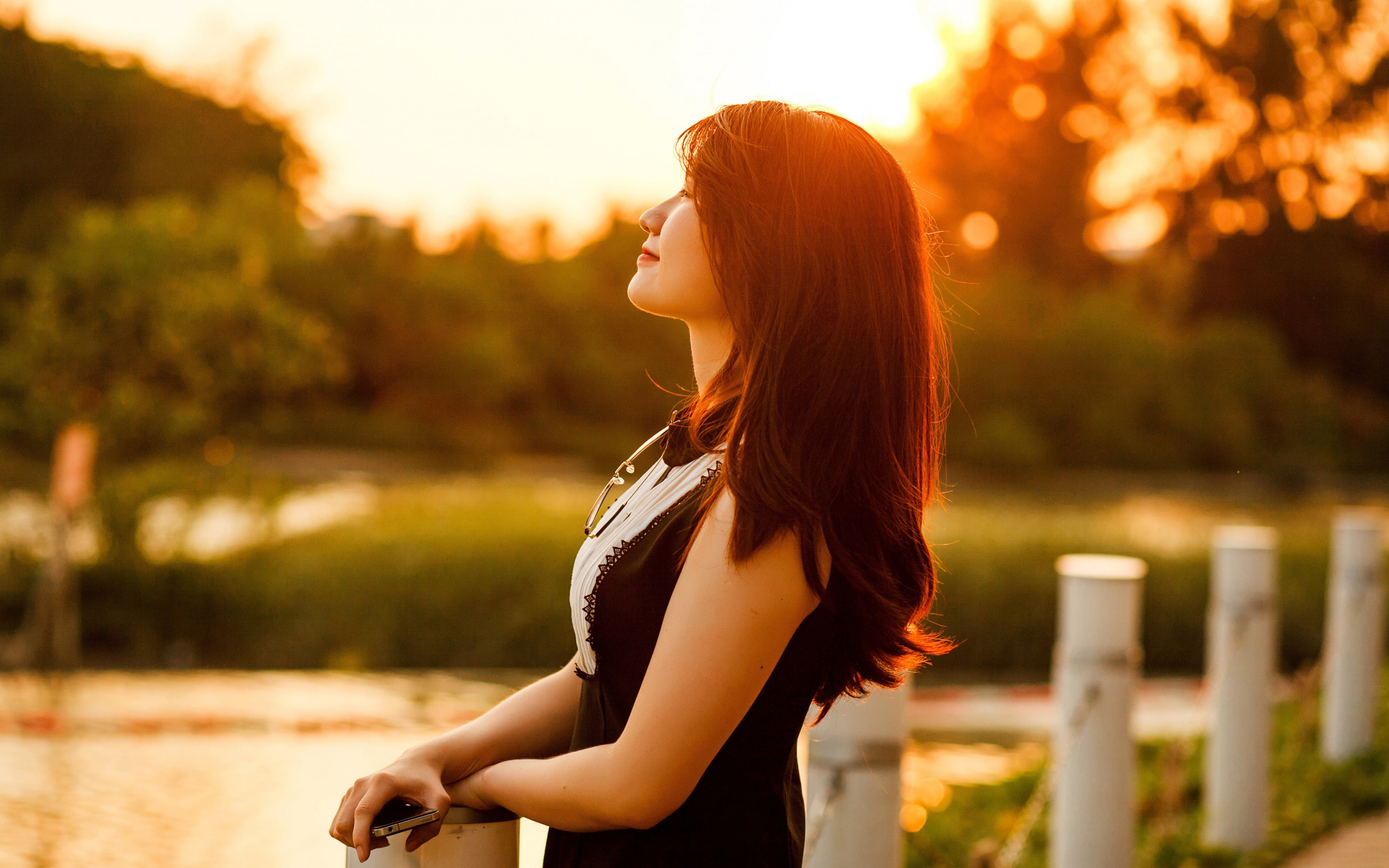 contemplation, brown hair, young women, outdoors, looking, sunlight, focus on foreground, girl, tree, nature, long hair, profile view, photo, one person, HD Wallpaper