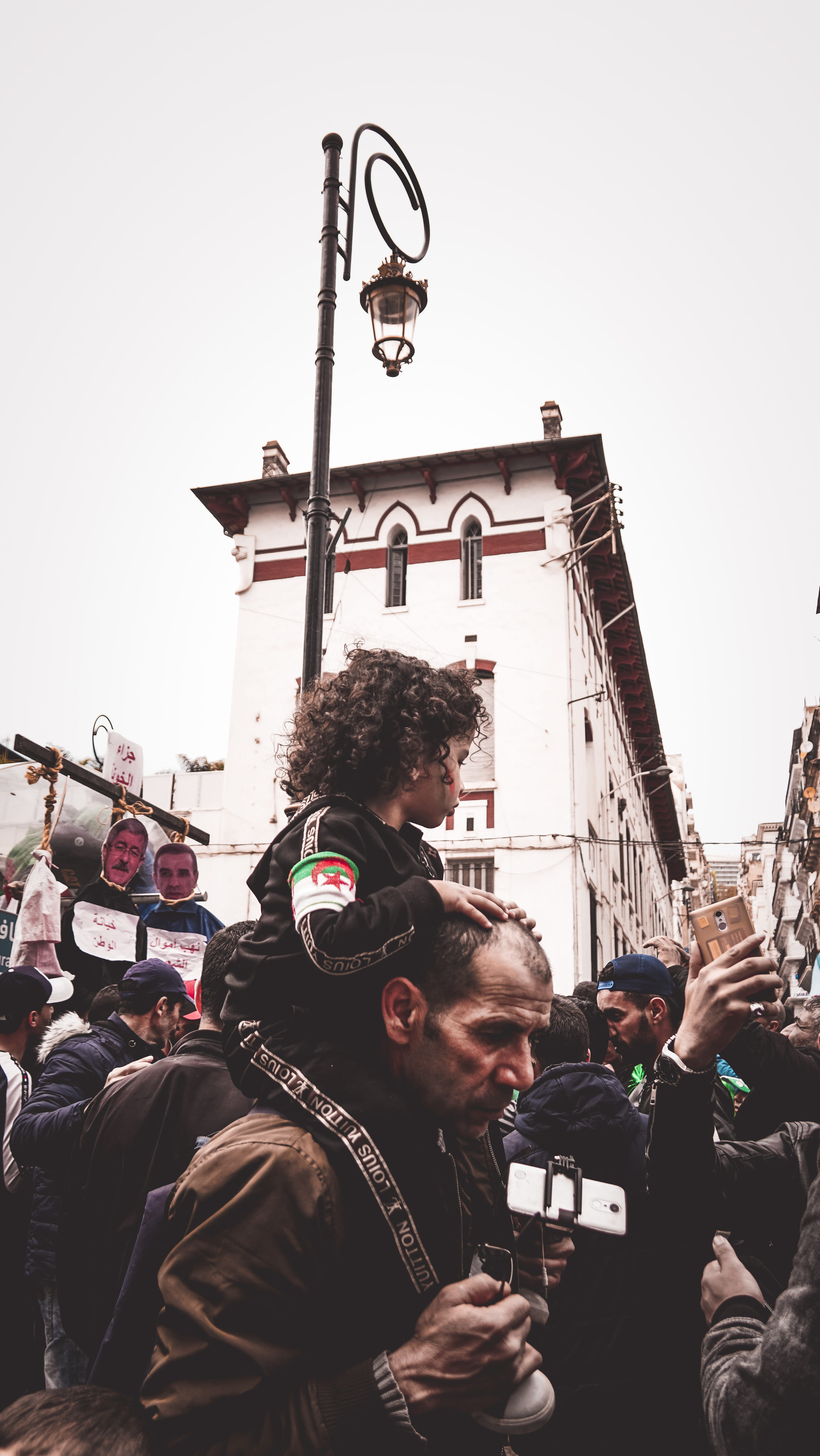 group of people, unsplash, lifestyles, human, oldman, father, manifistation, building exterior, street, children, help, crowd, clear sky, activity, curlyhair, Phone HD Wallpaper