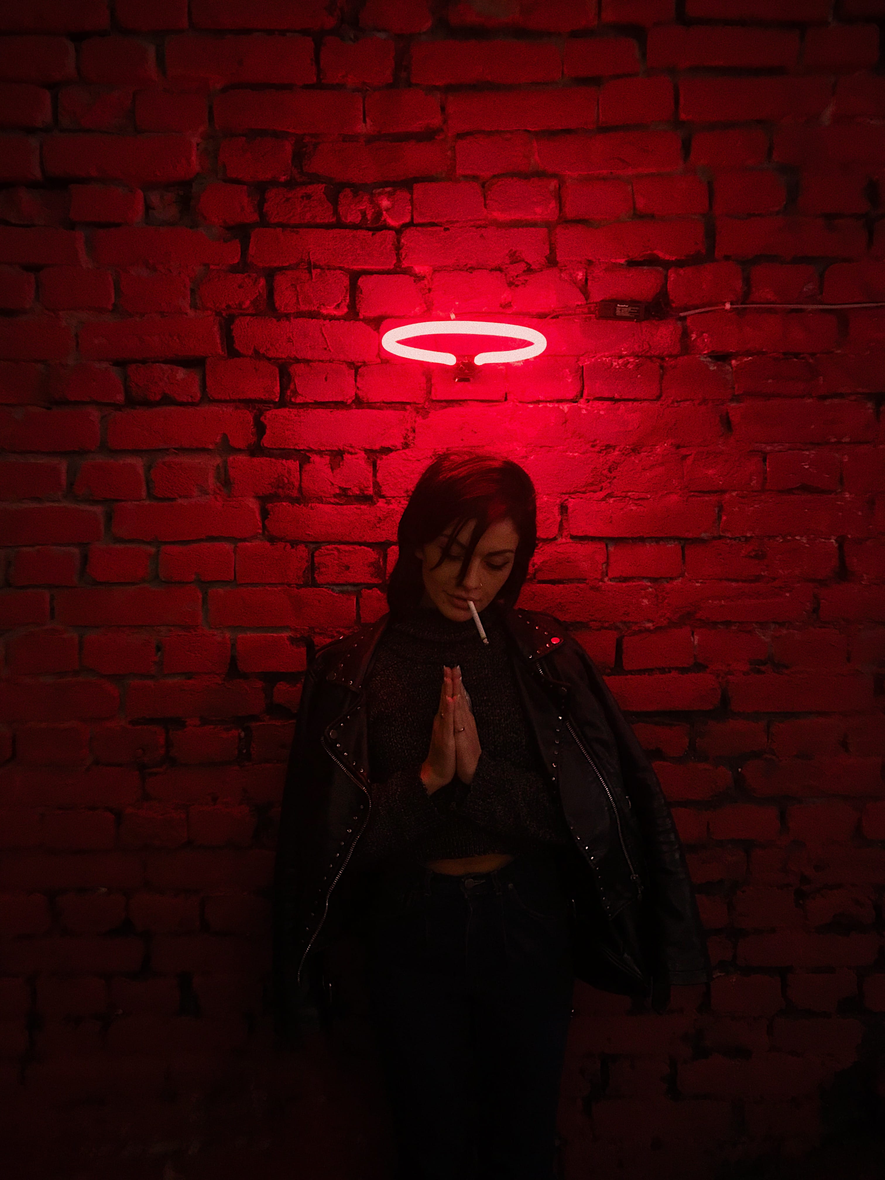 front view, praying, waist up, clothing, lifestyles, neon, night, one person, beautiful woman, casual clothing, wall - building feature, light, real people, Phone HD Wallpaper