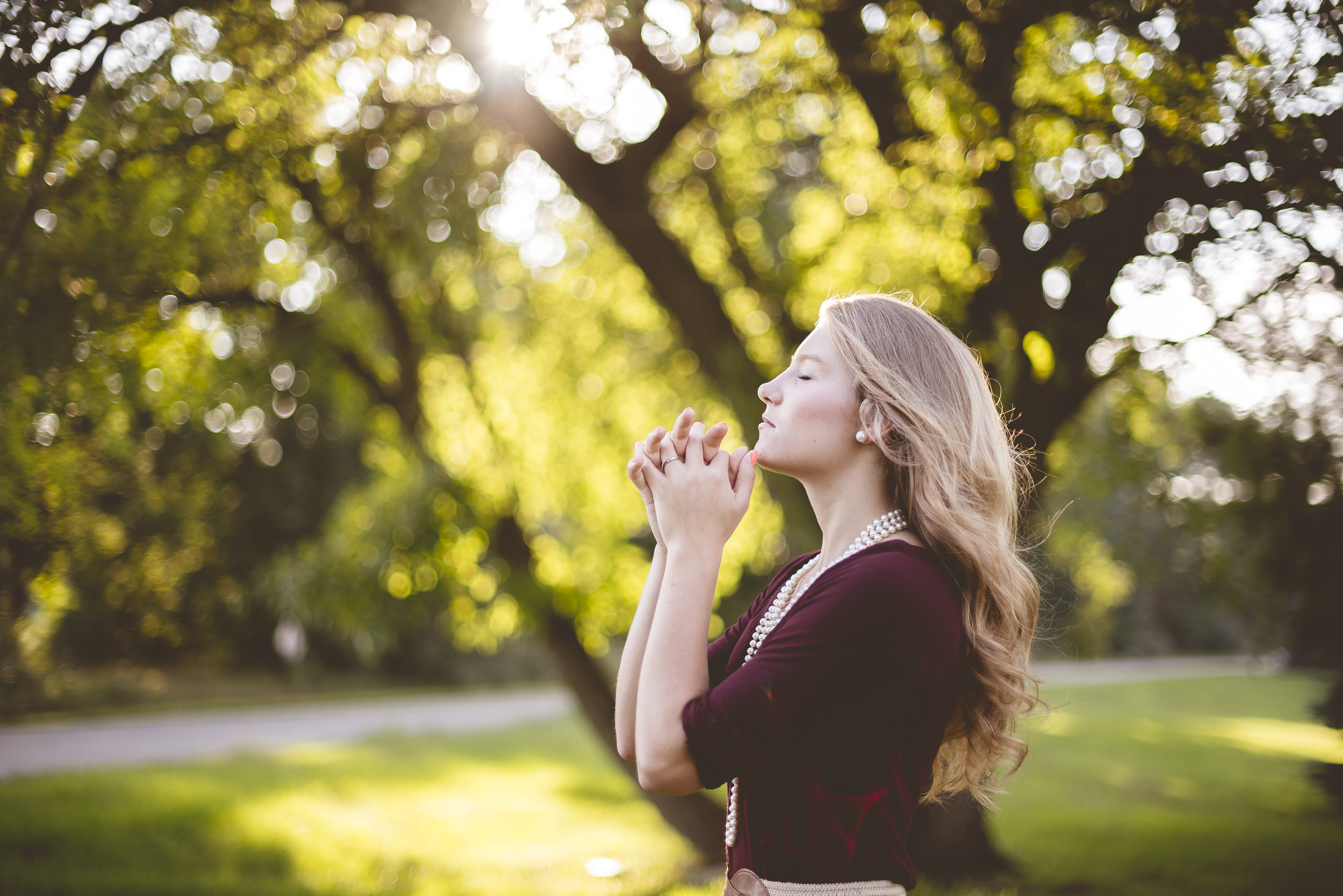 waist up, adult, standing, young women, young adult, real people, daytime, outdoors, praying, leisure activity, side view, focus on foreground, woman, lifestyles, HD Wallpaper