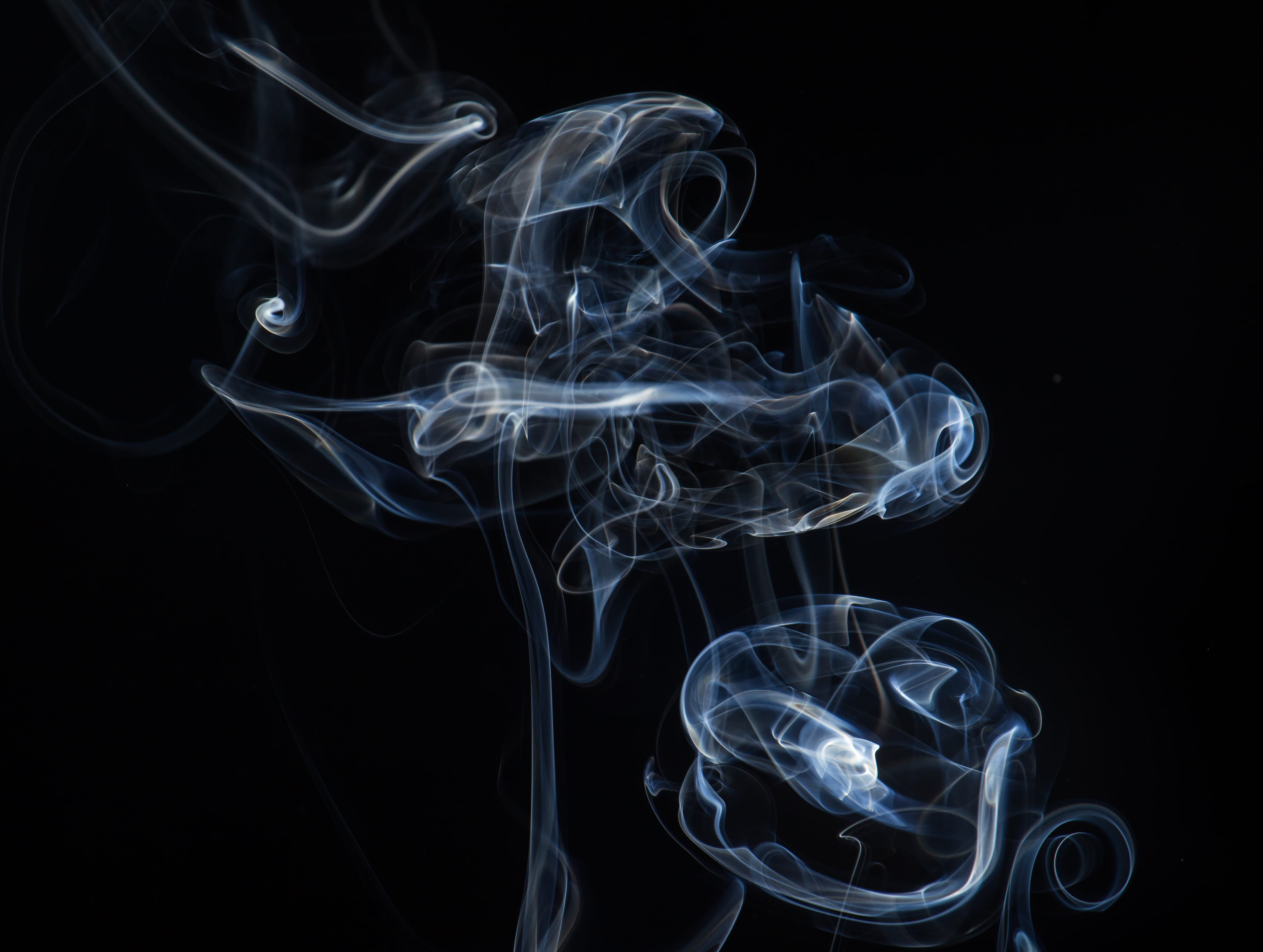 white color, luminosity, fragility, black background, changing form, motion, blue, copy space, complexity, art, pattern, indoors, cross, smoke, swirl, design, HD Wallpaper