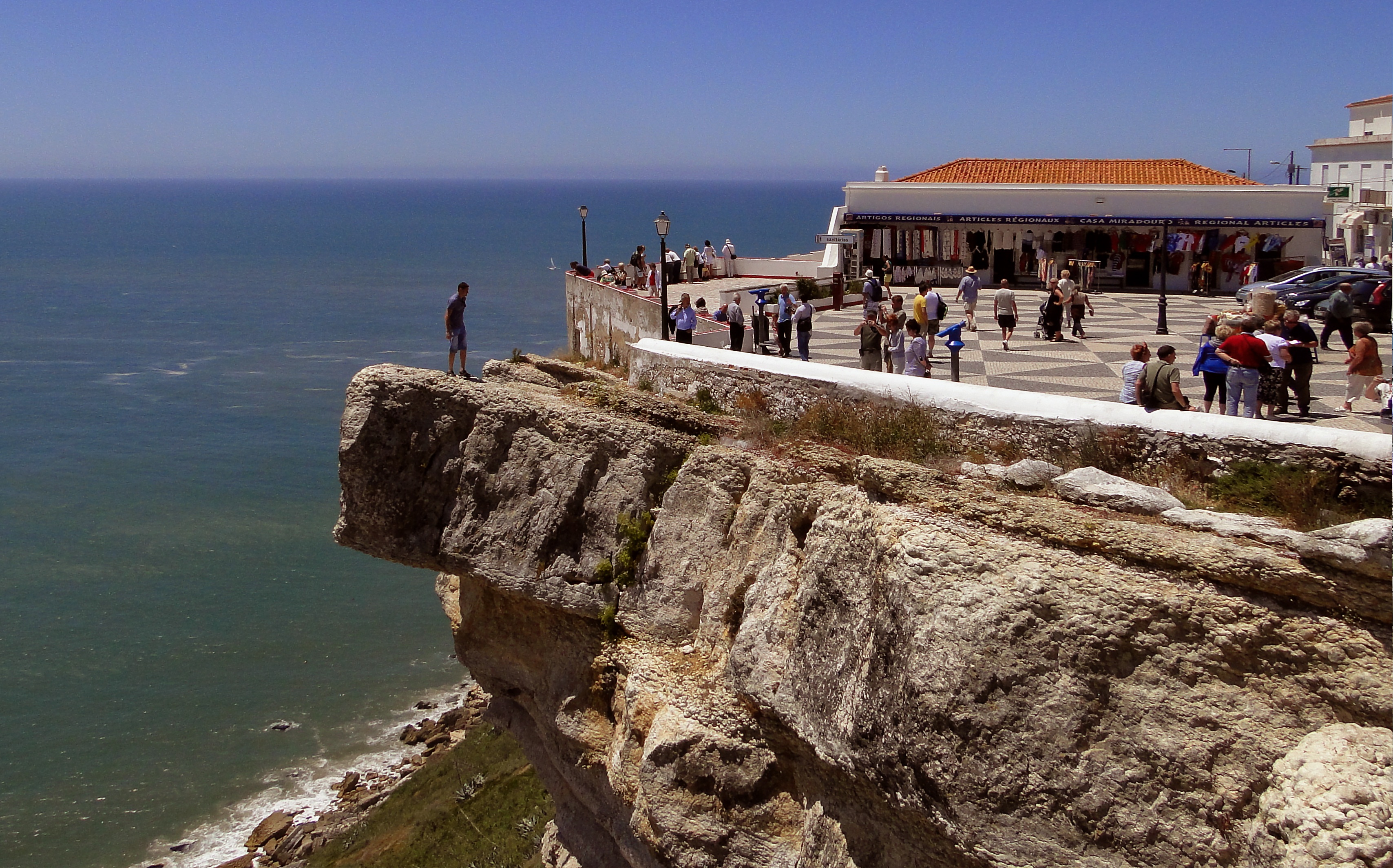 men, built structure, rocks, lifestyles, nazare, nature, portugal, land, water, rock, beach, craggy, cliff, a view of the sea, outdoors, horizon over water, HD Wallpaper