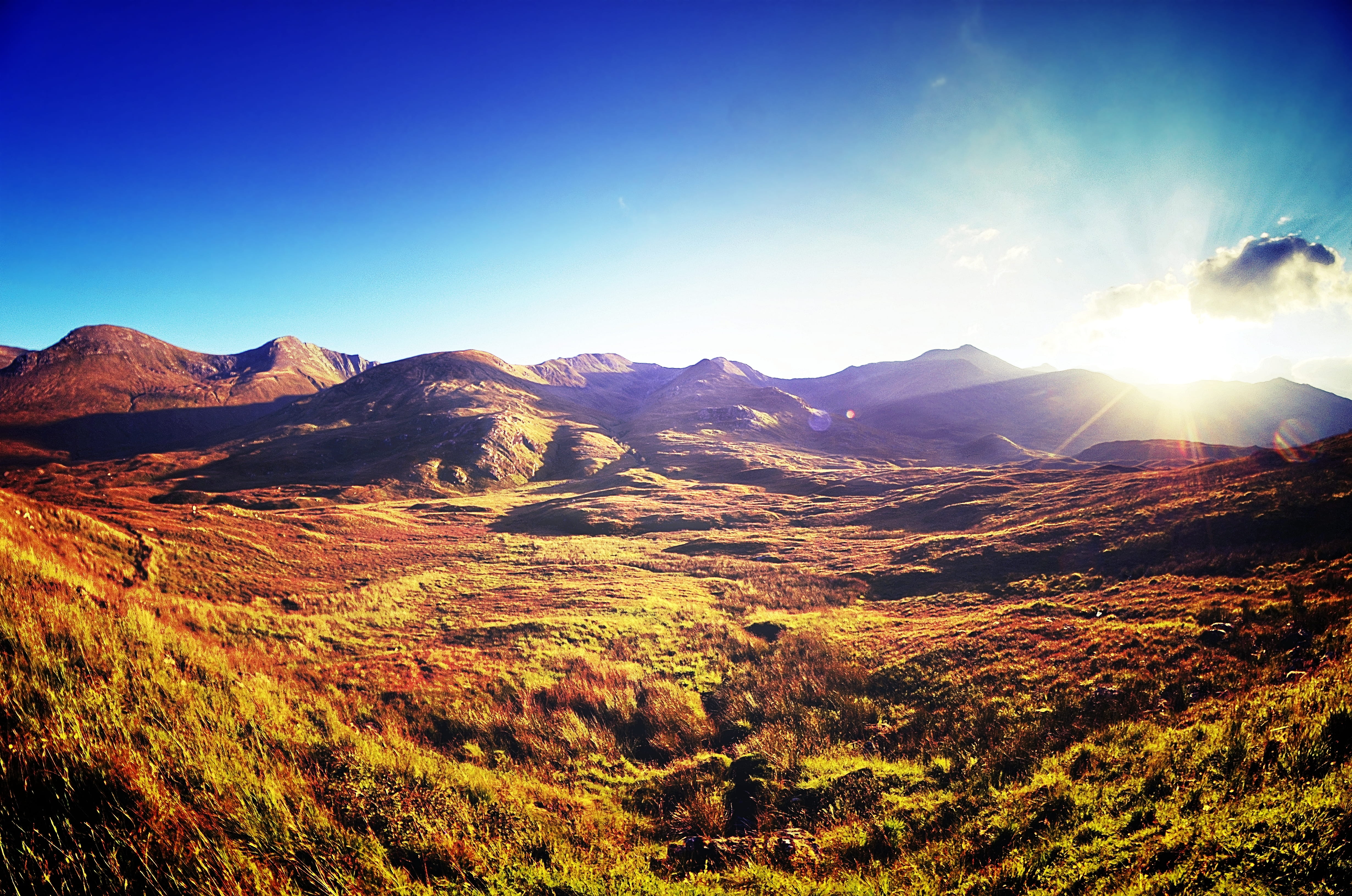 hill, travel, sunbeam, calm down, mountain, landscape, outdoor, remote, environment, sunlight, beauty in nature, mountain range, sun, skye, path, mountains, HD Wallpaper