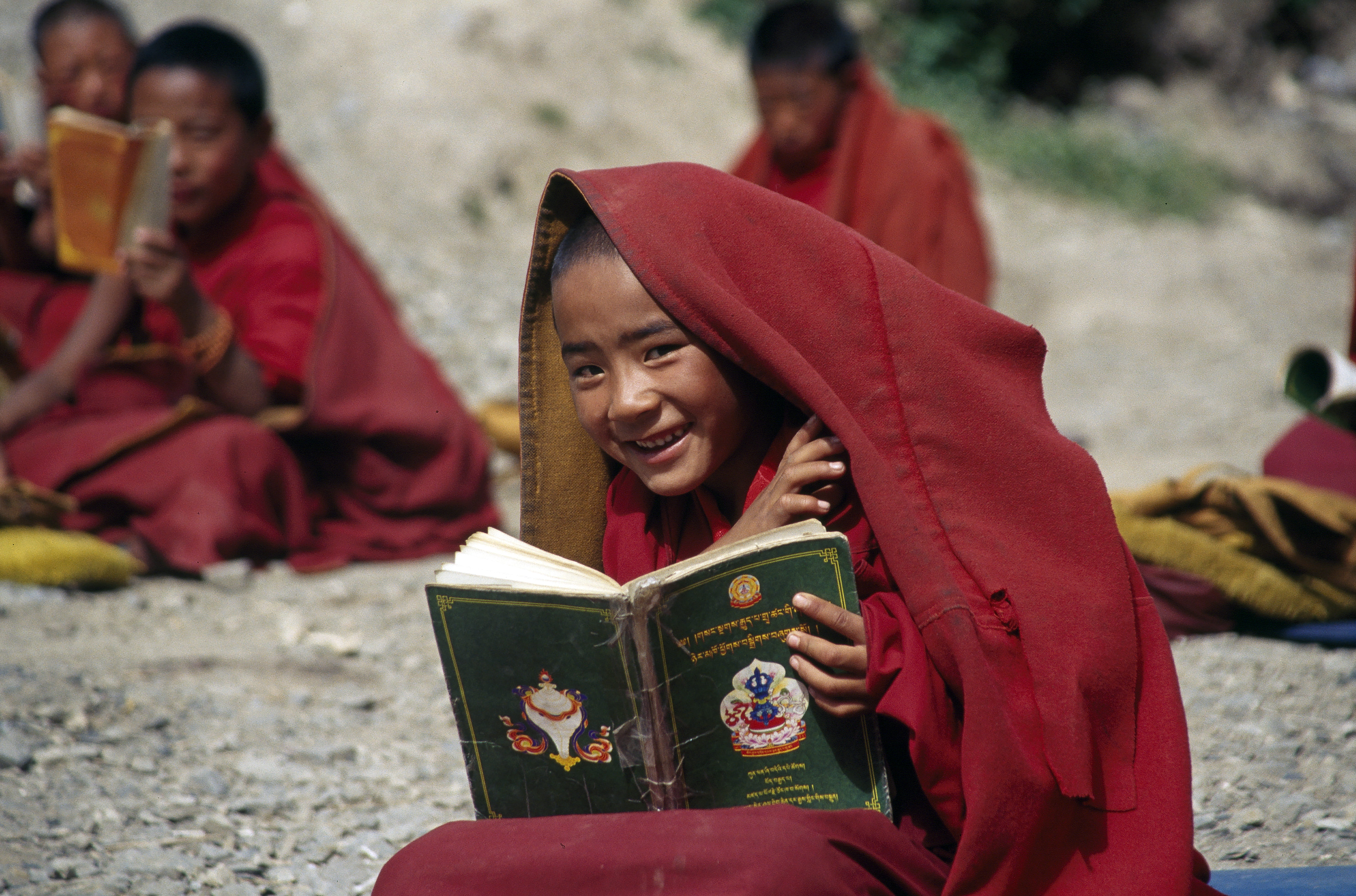 boy, reading, happiness, looking at camera, togetherness, outdoors, day, 5K, leisure activity, traditional clothing, happy, emotion, red, people, holding, HD Wallpaper