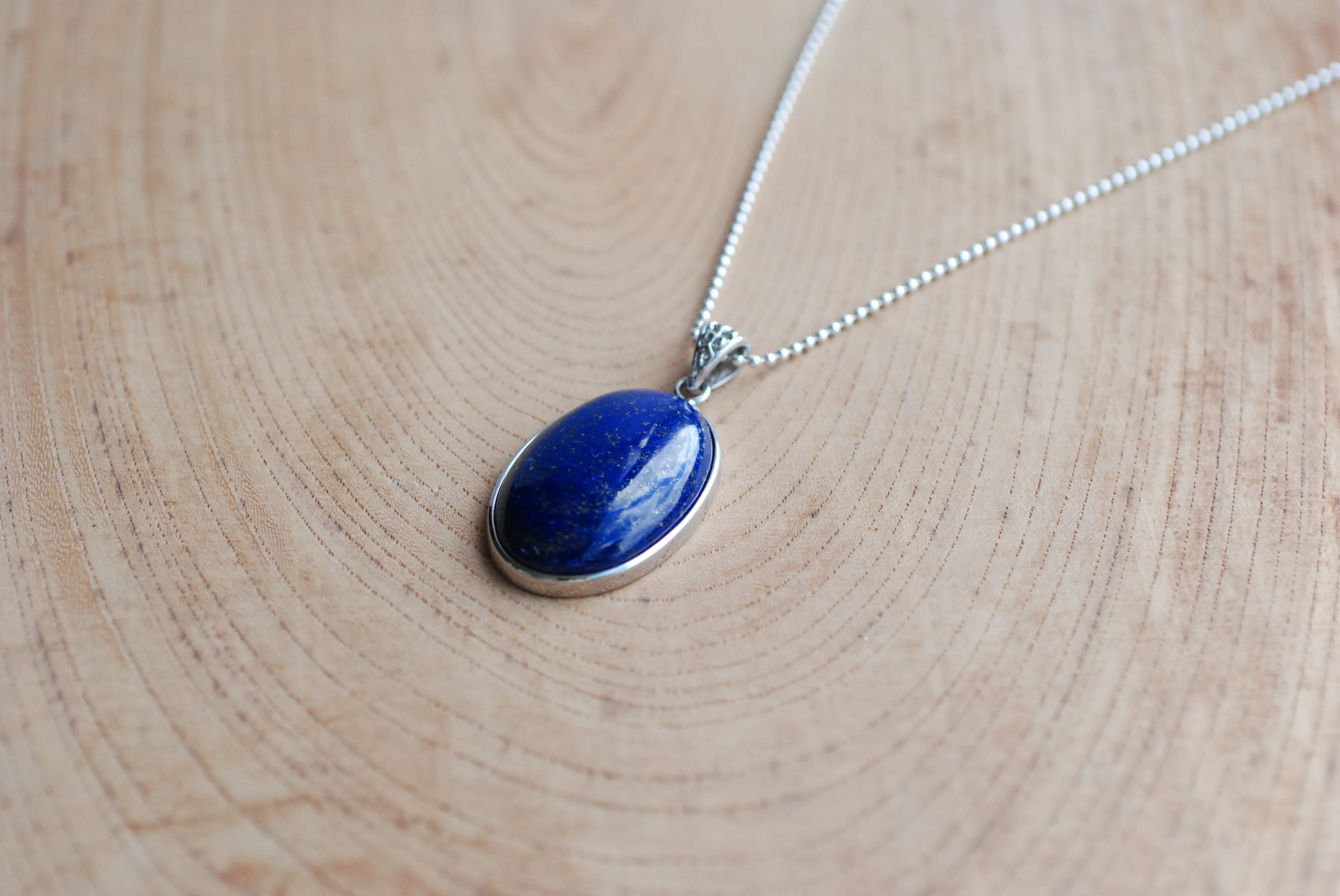 table, lapis lazuli, metal, no people, art and craft, pendant, wood - material, 4K, accessories, chain, still life, close-up, wood grain, luxury, ornate, HD Wallpaper