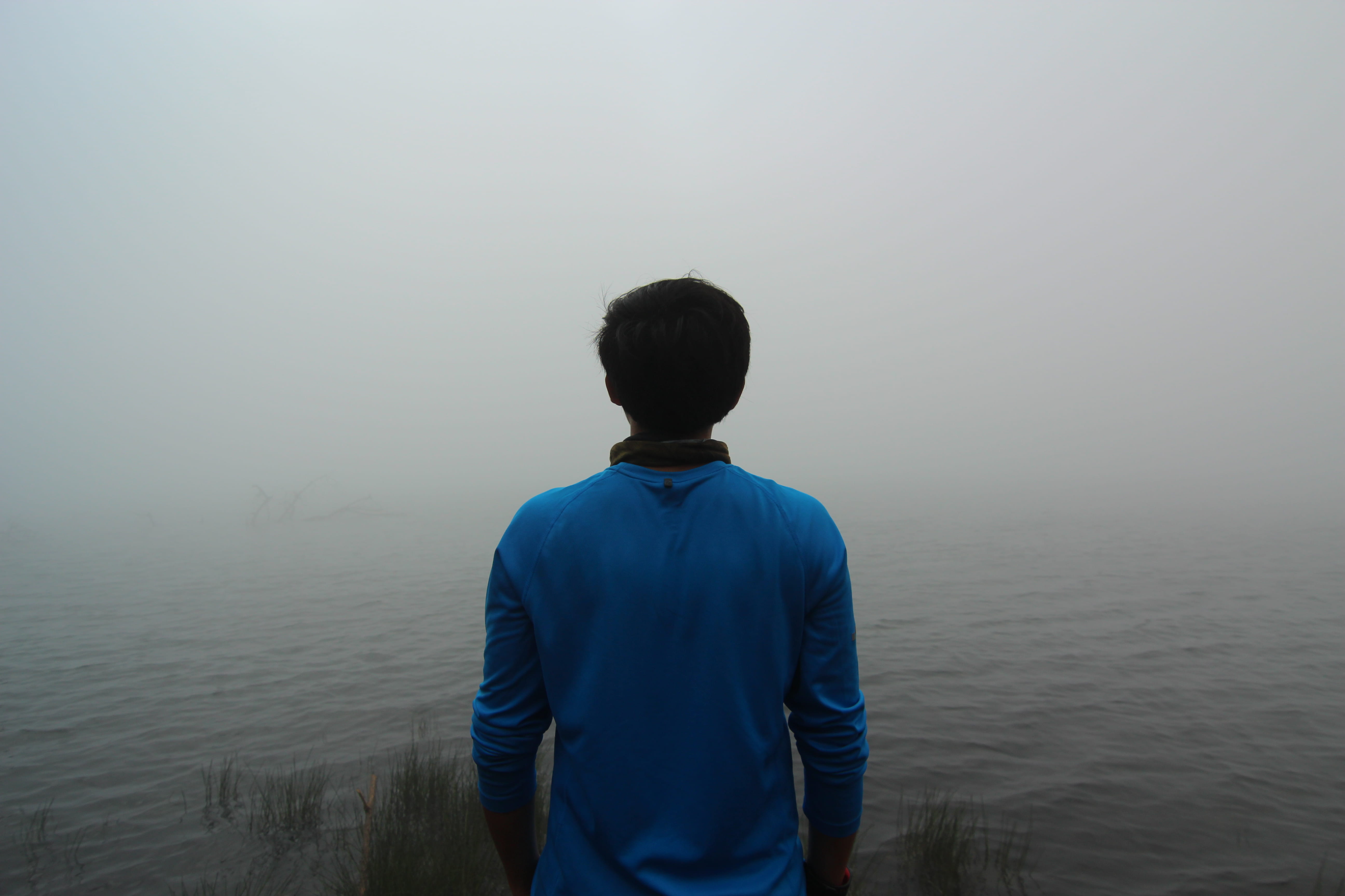 vacations, outdoors, men, looking at view, sea, standing, 5K, tranquility, real people, nike, misty, water, people, leisure activity, three quarter length, HD Wallpaper