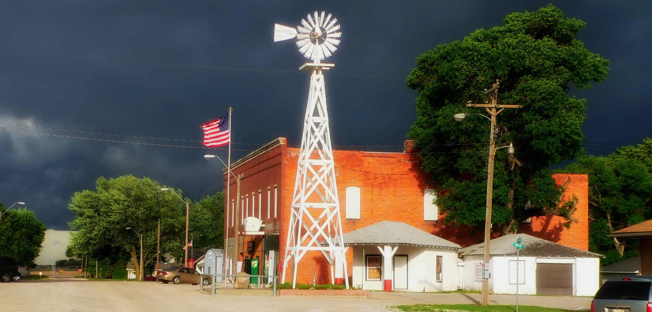 stormy, street, built structure, tree, dark sky, no people, building exterior, cloud - sky, vehicles, windmill, nebraska, nature, building, outside, transportation, HD Wallpaper