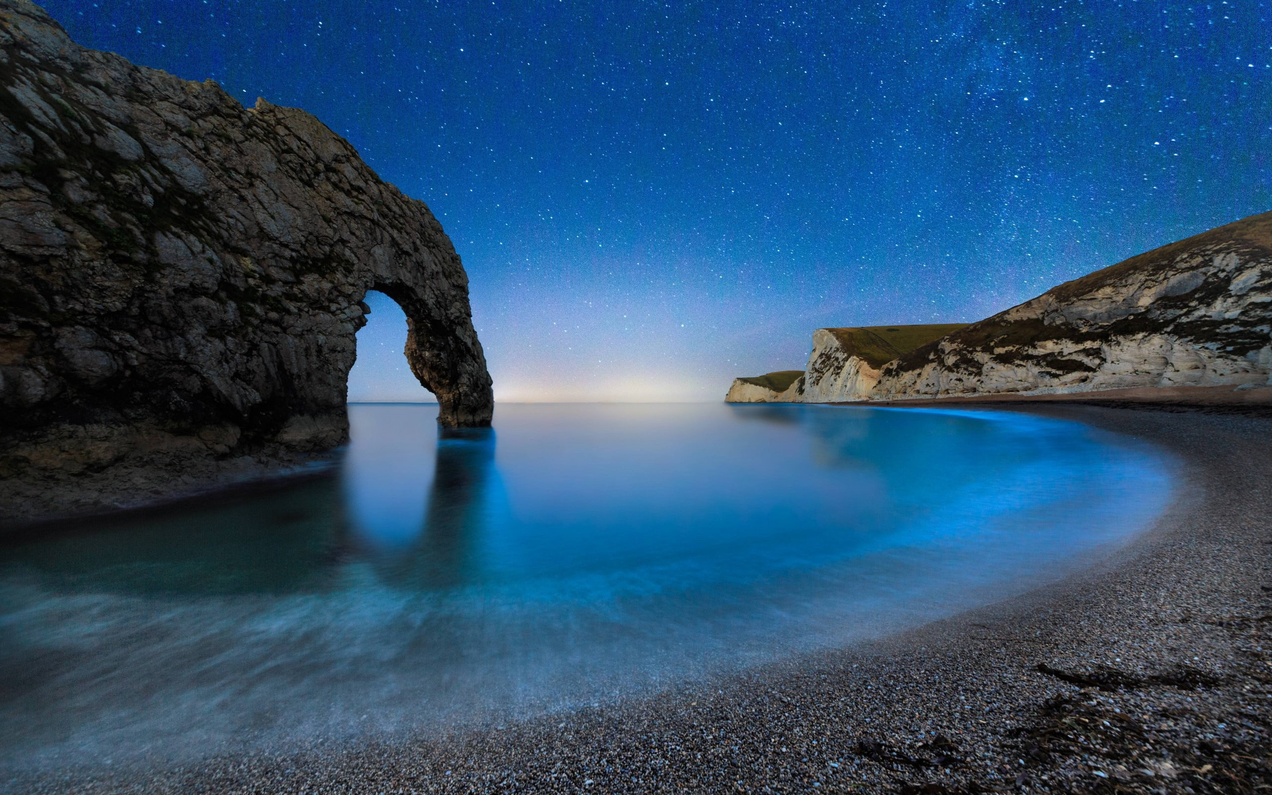 water, solid, land, no people, galaxy, natural arch, beauty in nature, long exposure, tranquility, scenery, rock - object, w, beach, stars, rock, milky way, HD Wallpaper