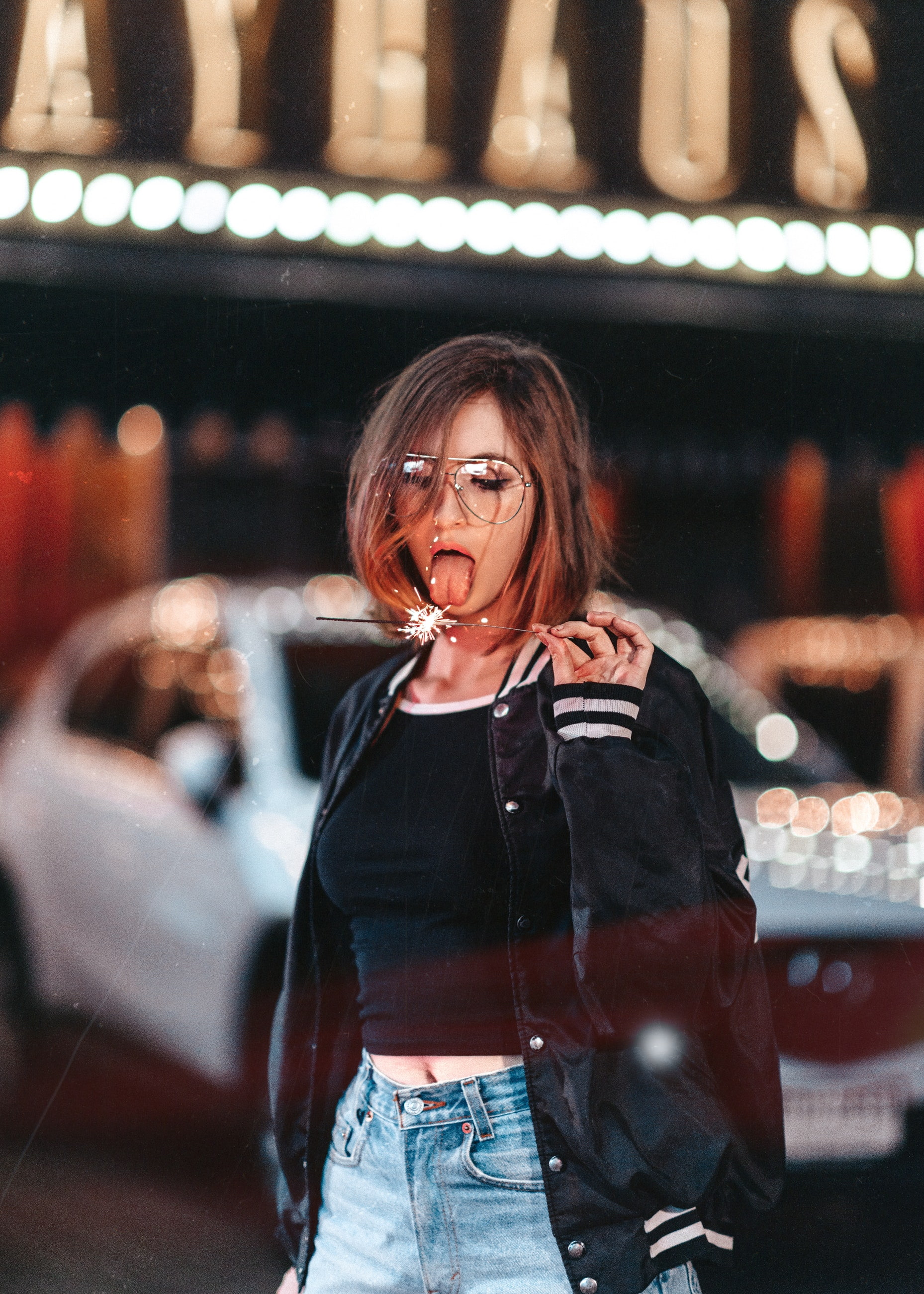 young adult, leather, hairstyle, looking, women, casual clothing, standing, tongue out, leisure activity, leather jacket, females, hair, tongues, emotion, Phone HD Wallpaper