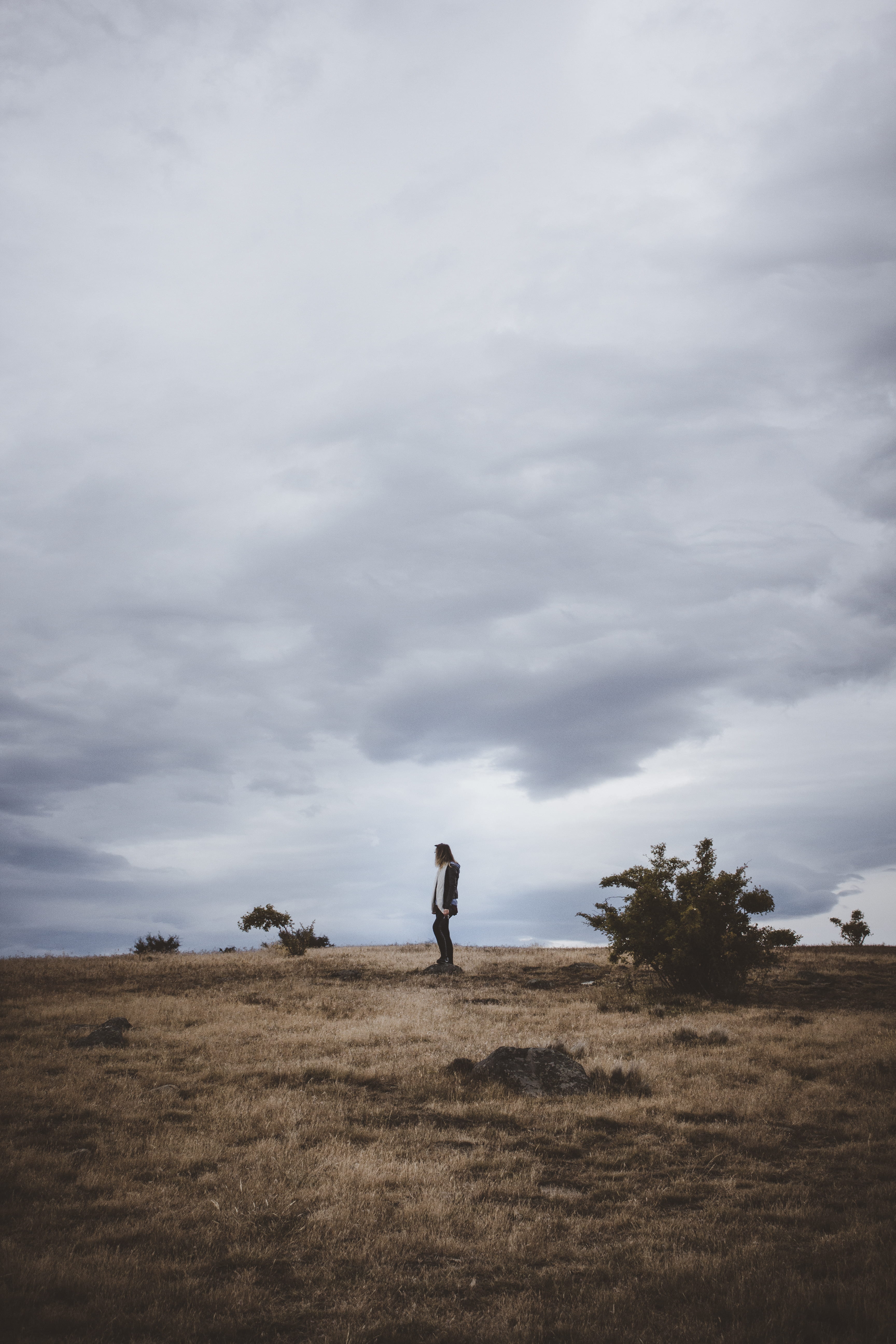 cloudy, leisure activity, cloud - sky, nature, beauty in nature, non-urban scene, plain, person, tranquil scene, sky, field, plant, outdoors, land, real people, Phone HD Wallpaper