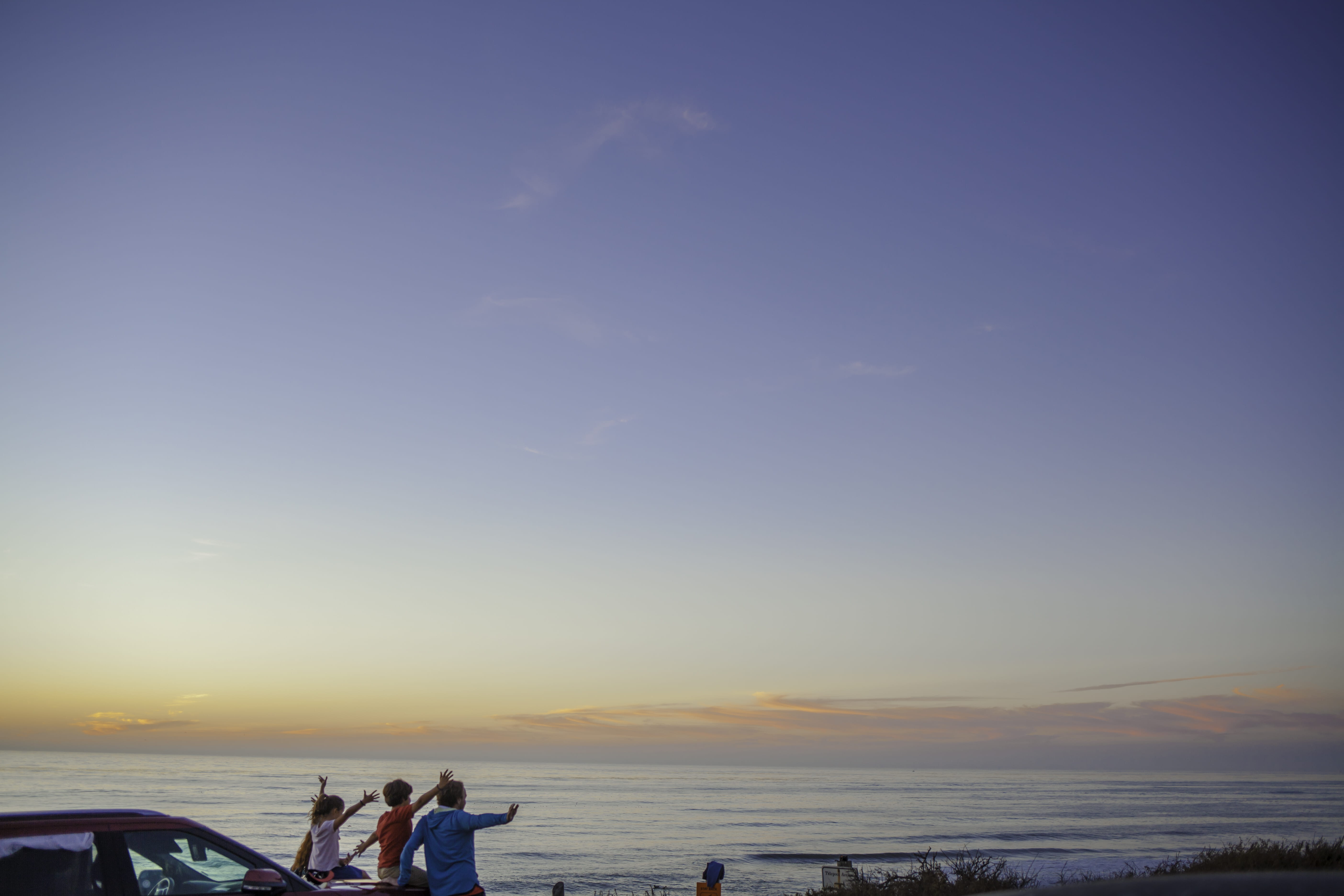 horizon, people, front, sitting, near, group of people, nature, outdoors, 5K, land, sky, sea, body, three, real people, leisure activity, tranquility, HD Wallpaper