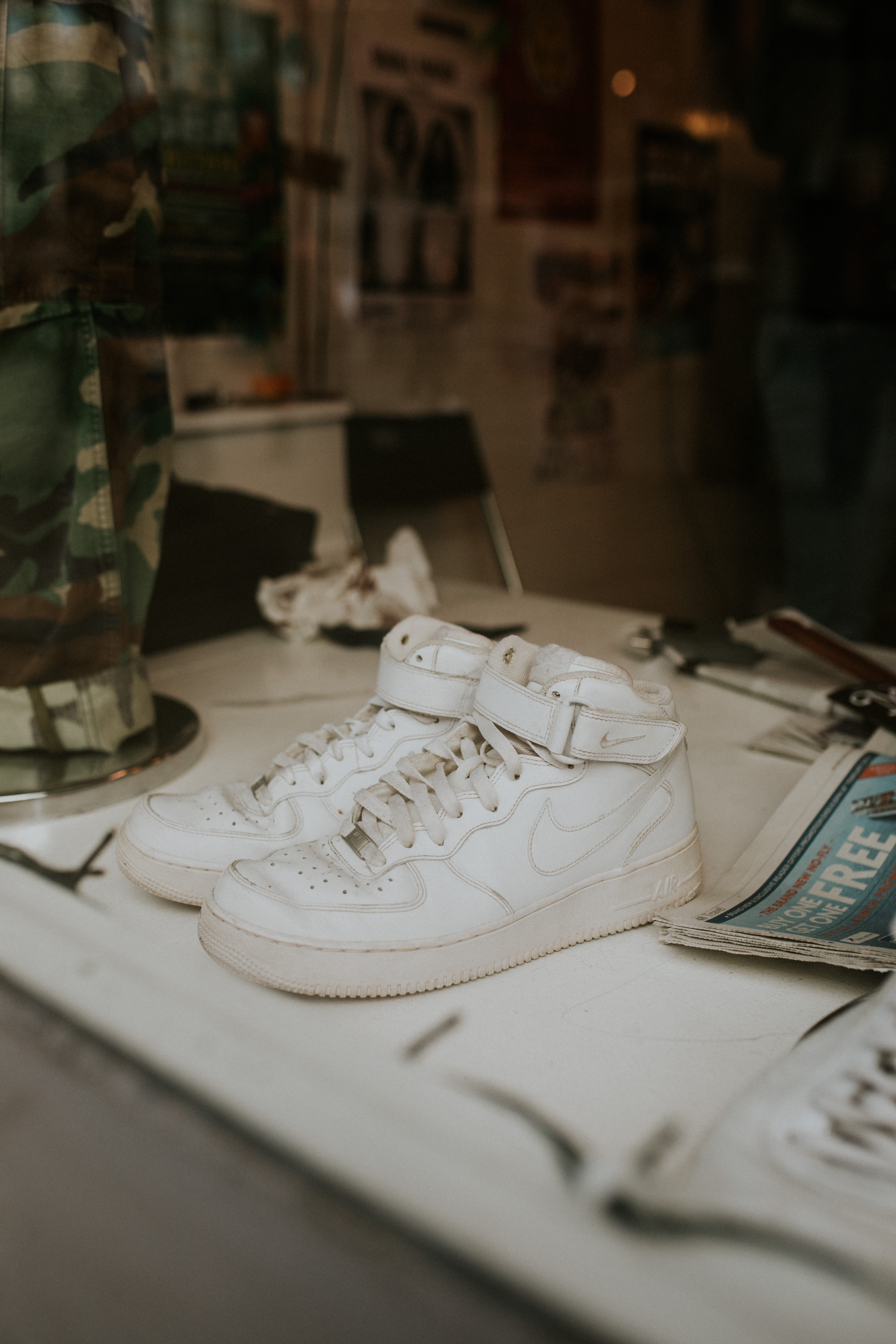 indoors, no people, nike, relaxation, creativity, publication, shoe, table, white, shoes, close-up, focus on foreground, air, book, selective focus, still life, Phone HD Wallpaper